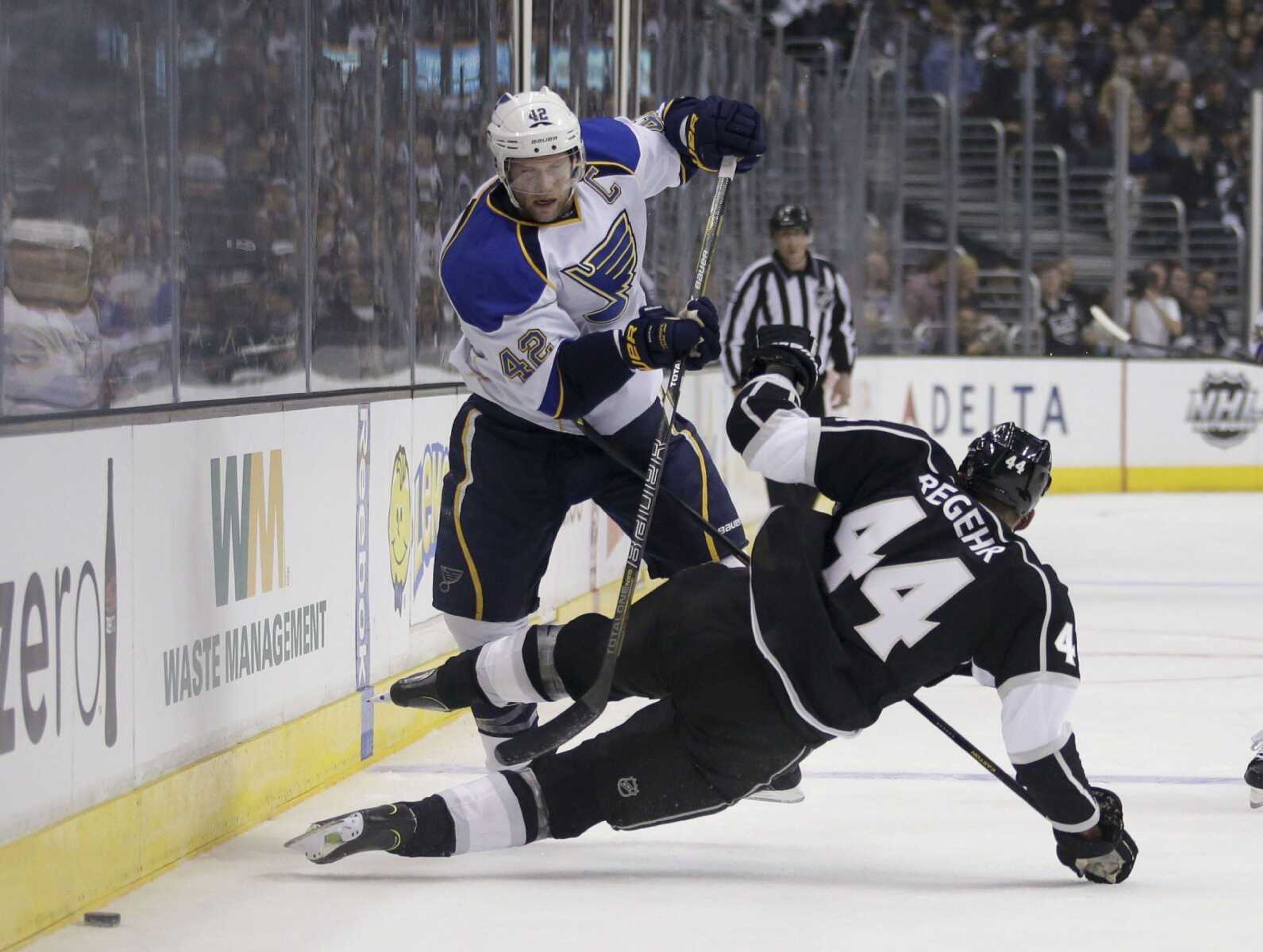 St. Louis Blues' David Backes, top, collides with Los Angeles Kings' Robyn Regehr, of Brazil, during the first period in Game 3 of a first-round NHL hockey Stanley Cup playoff series n Los Angeles, Saturday, May 4, 2013. (AP Photo/Jae C. Hong)