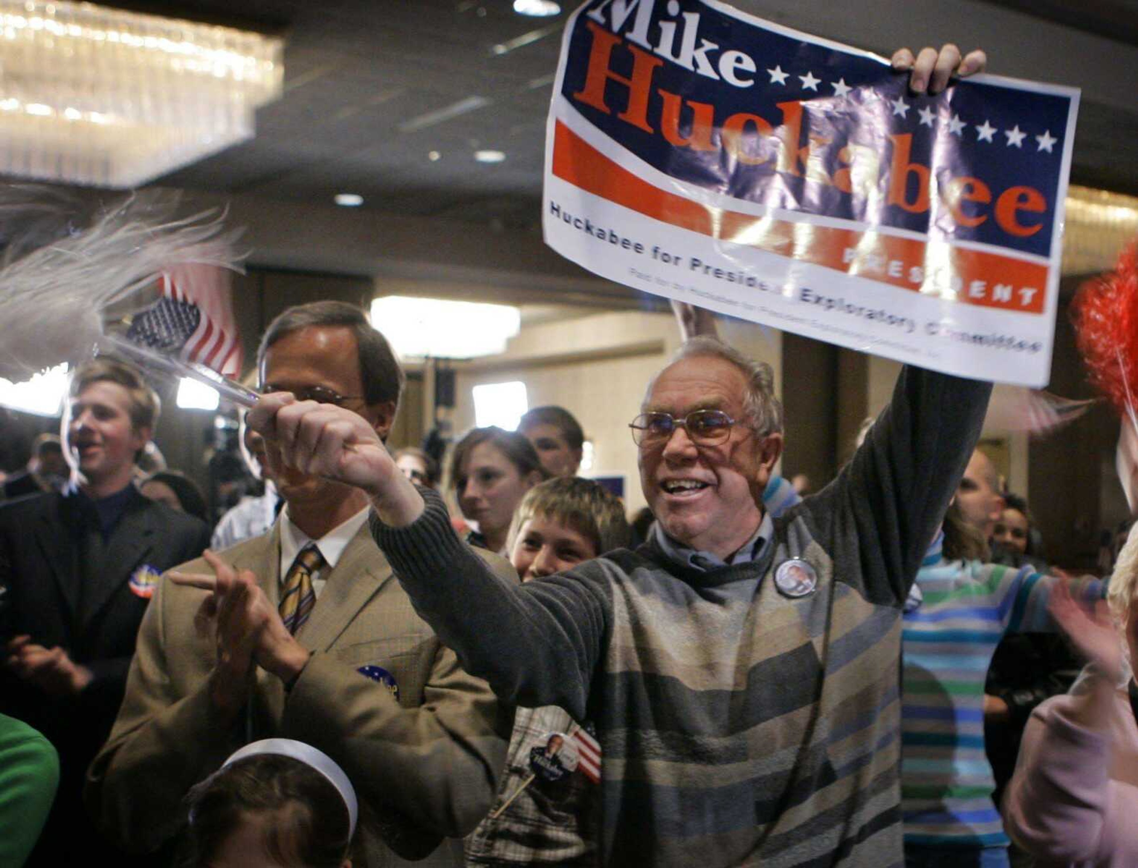 James Patrick of Carterville, Ill., reacted Thursday at a victory party in Des Moines, Iowa, to televised caucus returns showing Republican presidential hopeful former Arkansas Governor Mike Huckabee taking an early lead. (Paul Sancya ~ Associated Press)