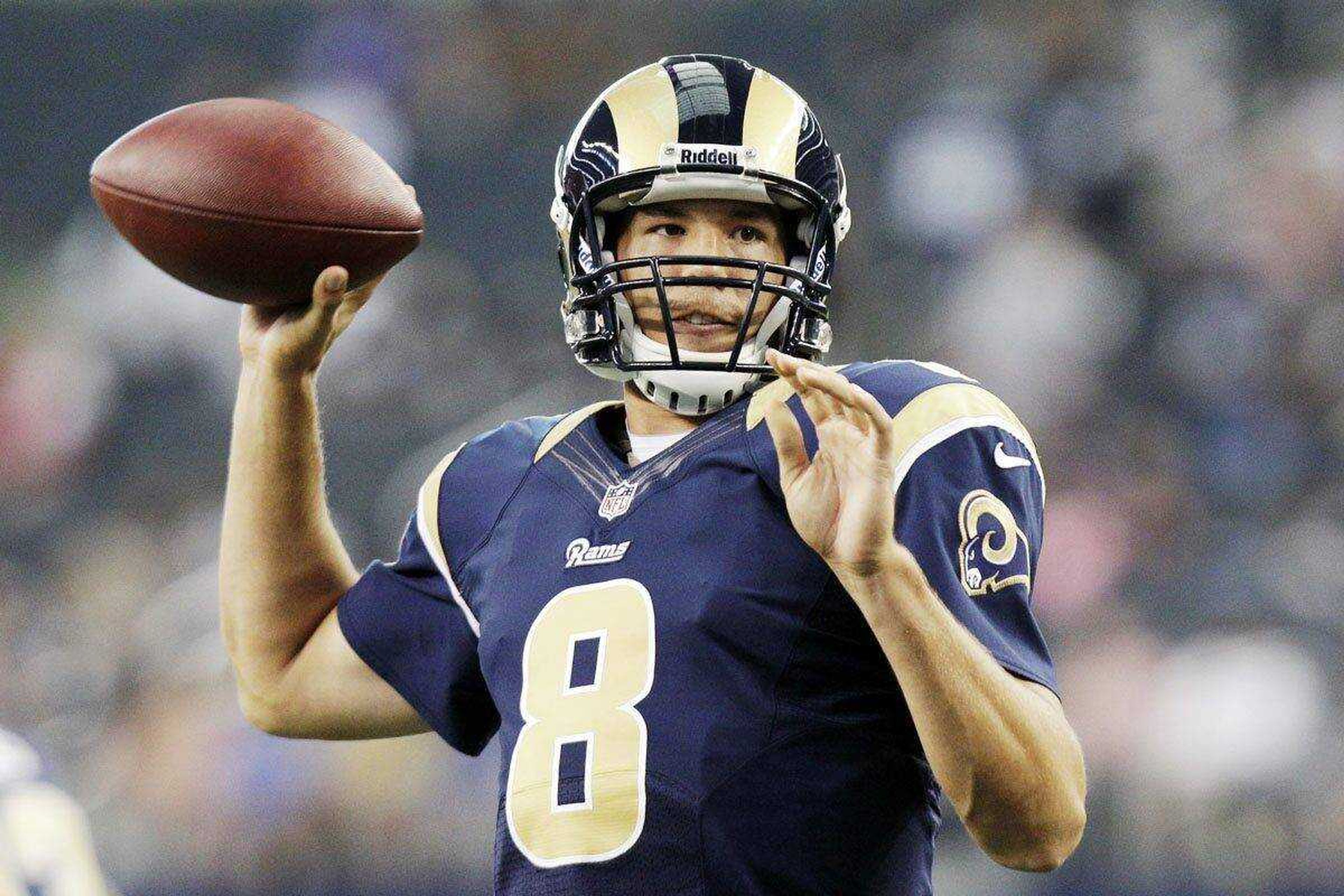 Rams quarterback Sam Bradford warms up before a preseason game against the Cowboys in Arlington, Texas. Bradford begins his third season with the Rams after being the first overall selection in the 2010 draft. (Associated Press file photo)