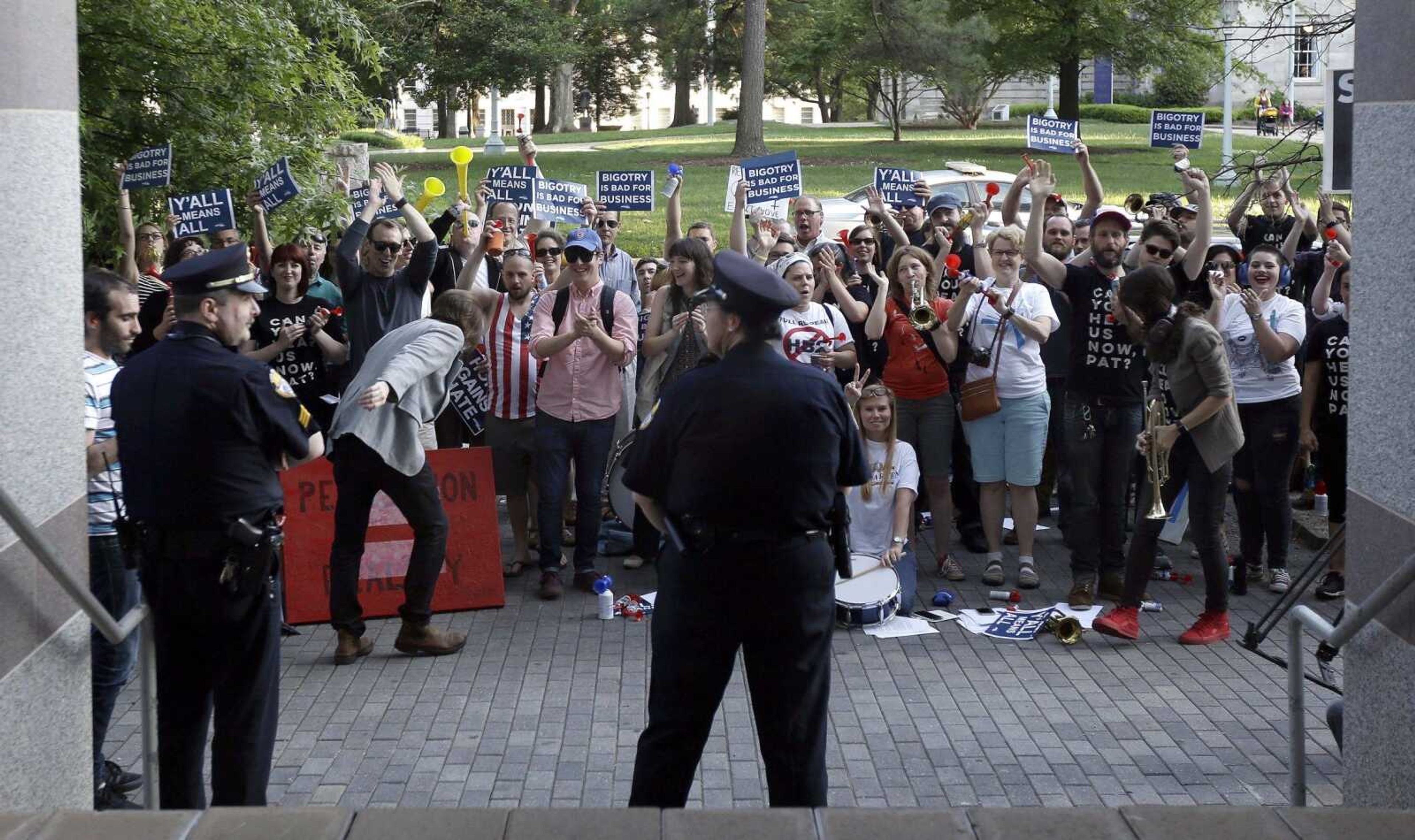 Protesters gather outside the the North Carolina Museum of History on Wednesday as Gov. Pat McCrory make remarks about House Bill 2 during a government affairs conference in Raleigh, North Carolina.