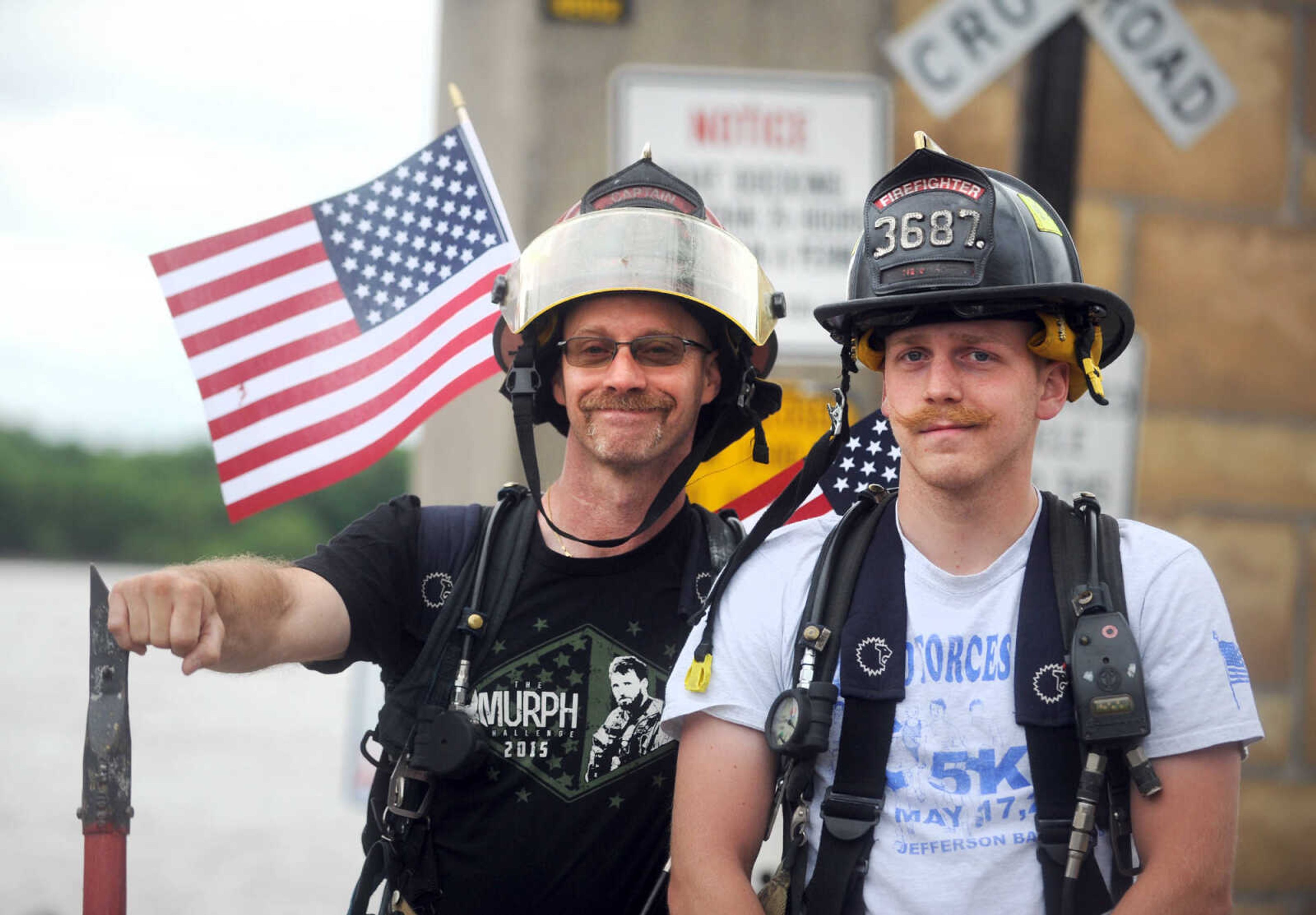 LAURA SIMON ~ lsimon@semissourian.com

Trent August, left, poses for a photo with his son, Nick, during the first ever Carry the Load event, Monday, May 25, 2015, in Cape Girardeau.