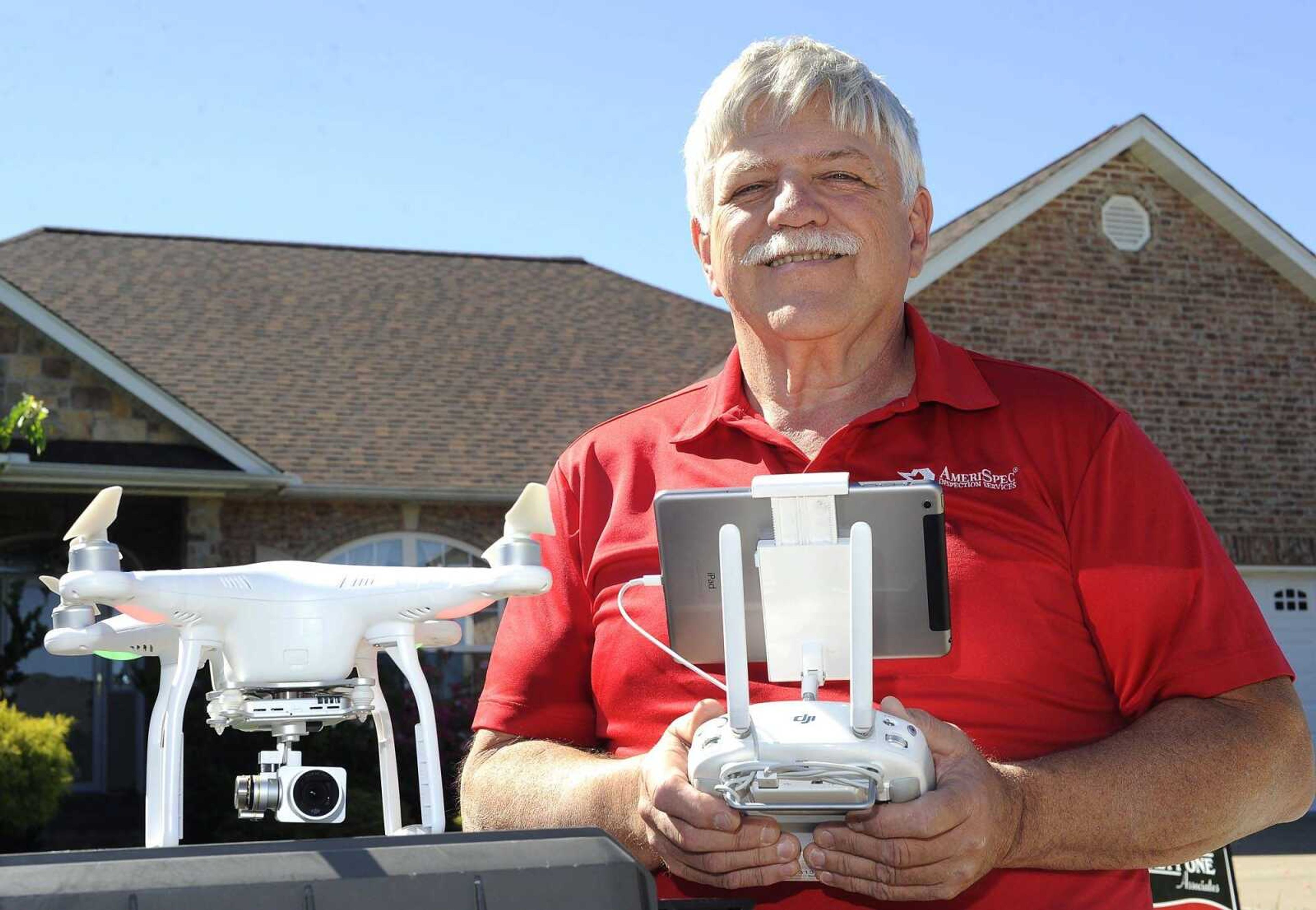 Sam Herndon, owner of AmeriSpec Home Inspectors, poses for a photo with his drone on Tuesday, May 2, 2017 in Cape Girardeau.