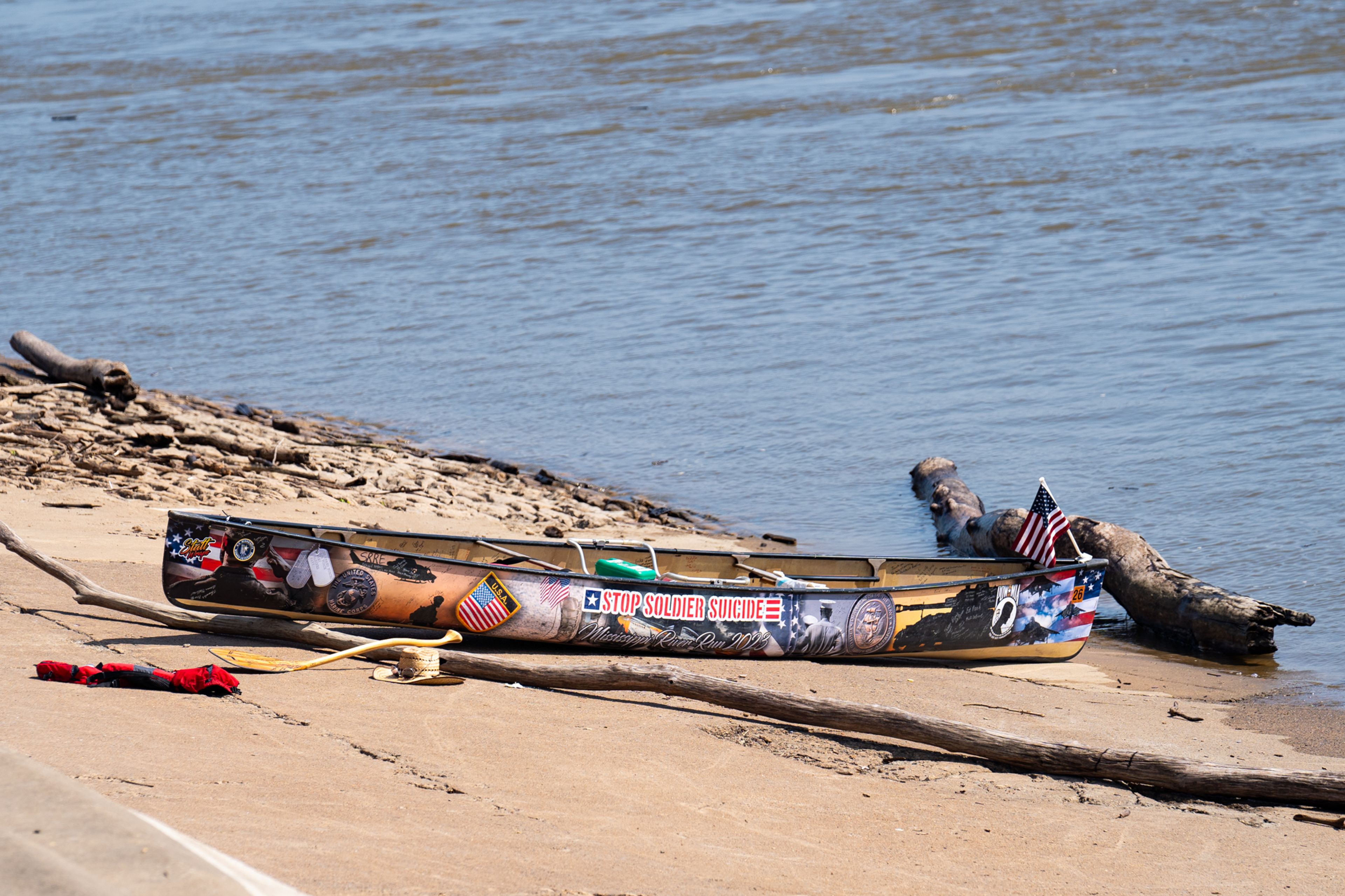 Frank Lachinski's boat sits at the bottom of the Cape Girardeau river wall after they were rescued from the Mississippi River on Friday, Aug. 23.