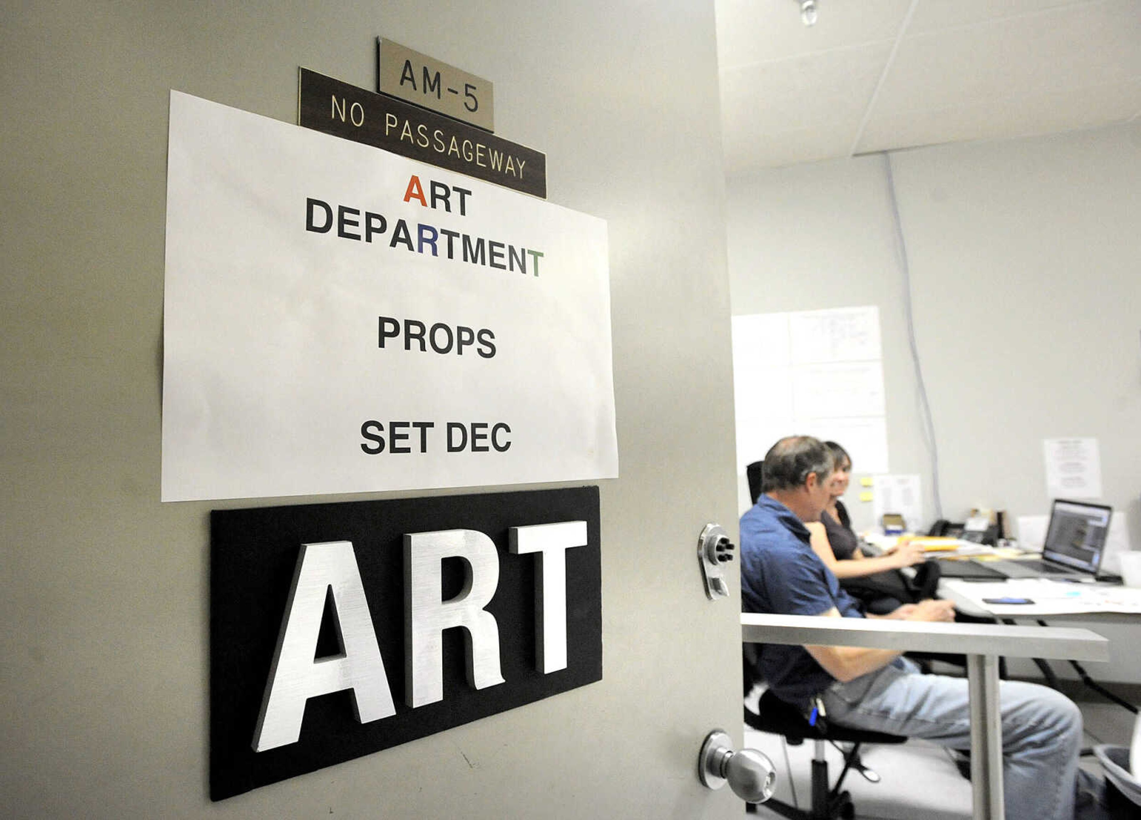 LAURA SIMON ~ lsimon@semissourian.com

Art department staff for the feature film "Gone Girl" work in their temporary office in Cape Girardeau.