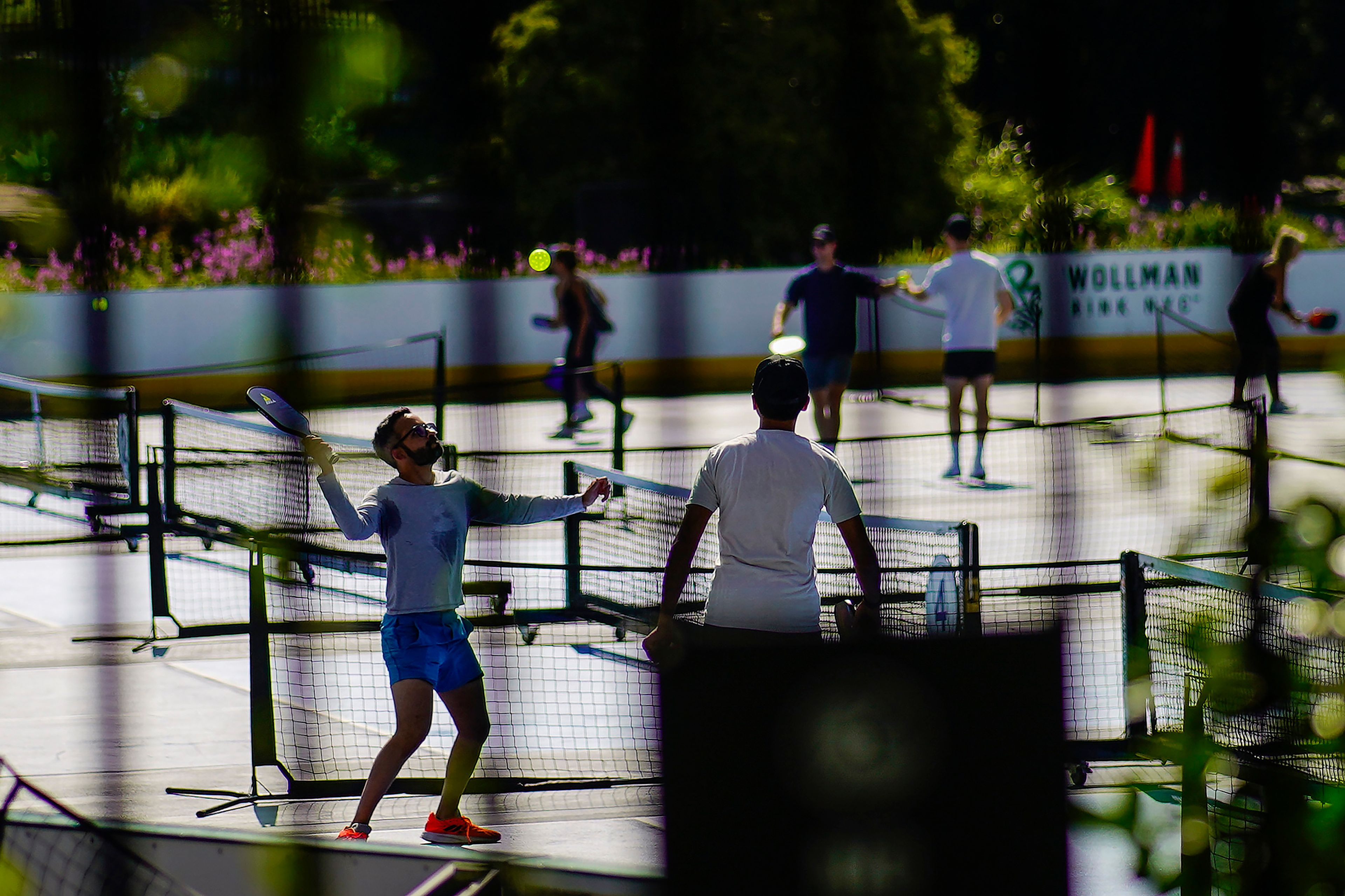 People practice pickleball on the courts of CityPickle at Central Park's Wollman Rink, Saturday, Aug. 24, 2024, in New York. (AP Photo/Eduardo Munoz Alvarez)