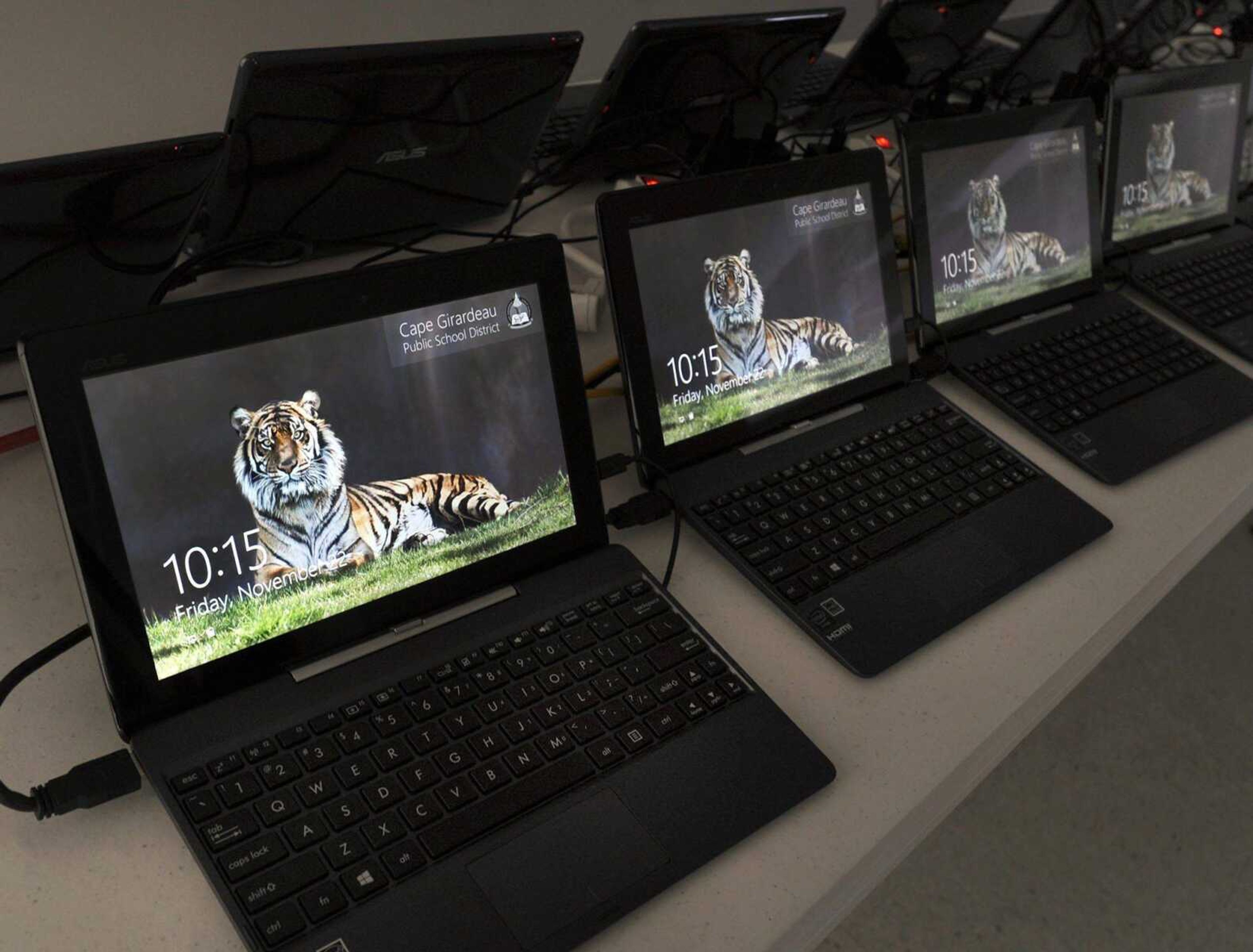 Convertible laptop computers are being loaded with software Friday for Central High School students to begin using in January. Teachers say the usage of computers and social media on smartphones has caused students&#8217; writing skills to wither. (Fred Lynch)