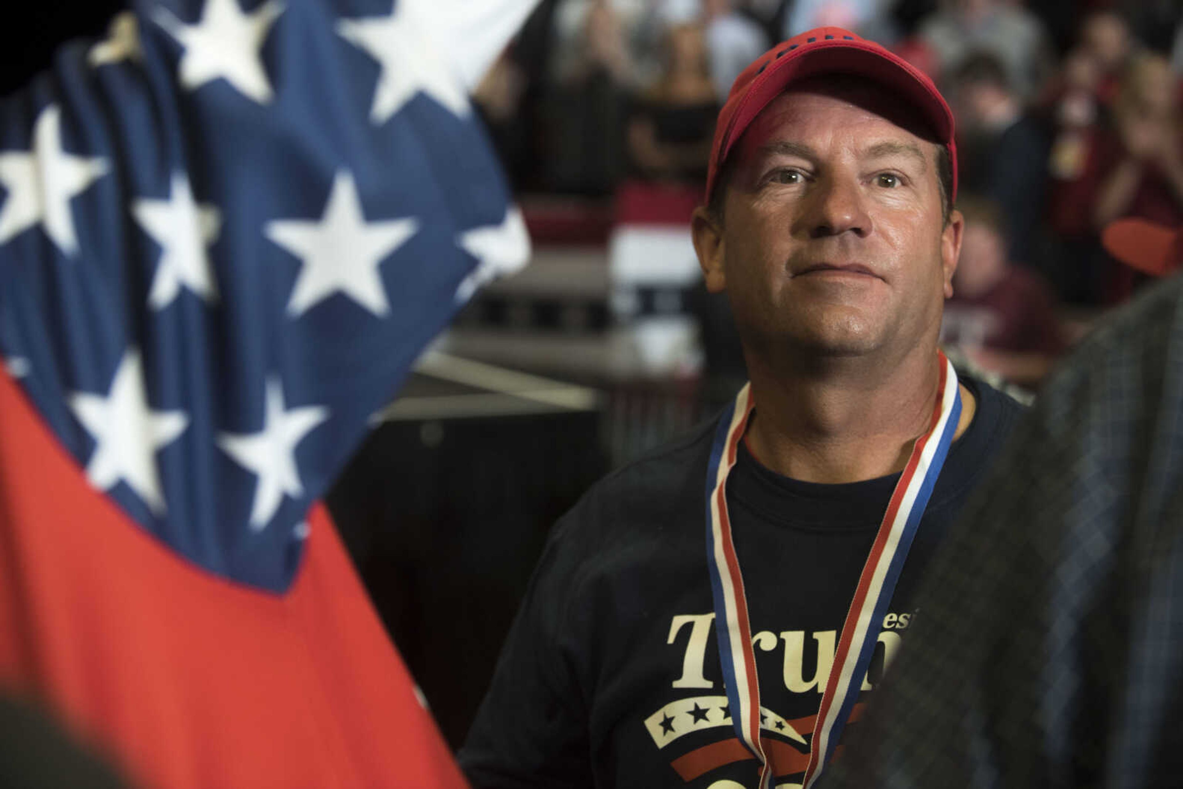 A rally attendee listens as Rush Limbaugh introduces President Donald Trump during a Make America Great Again rally Monday, Nov. 5, 2018, at the Show Me Center in Cape Girardeau.