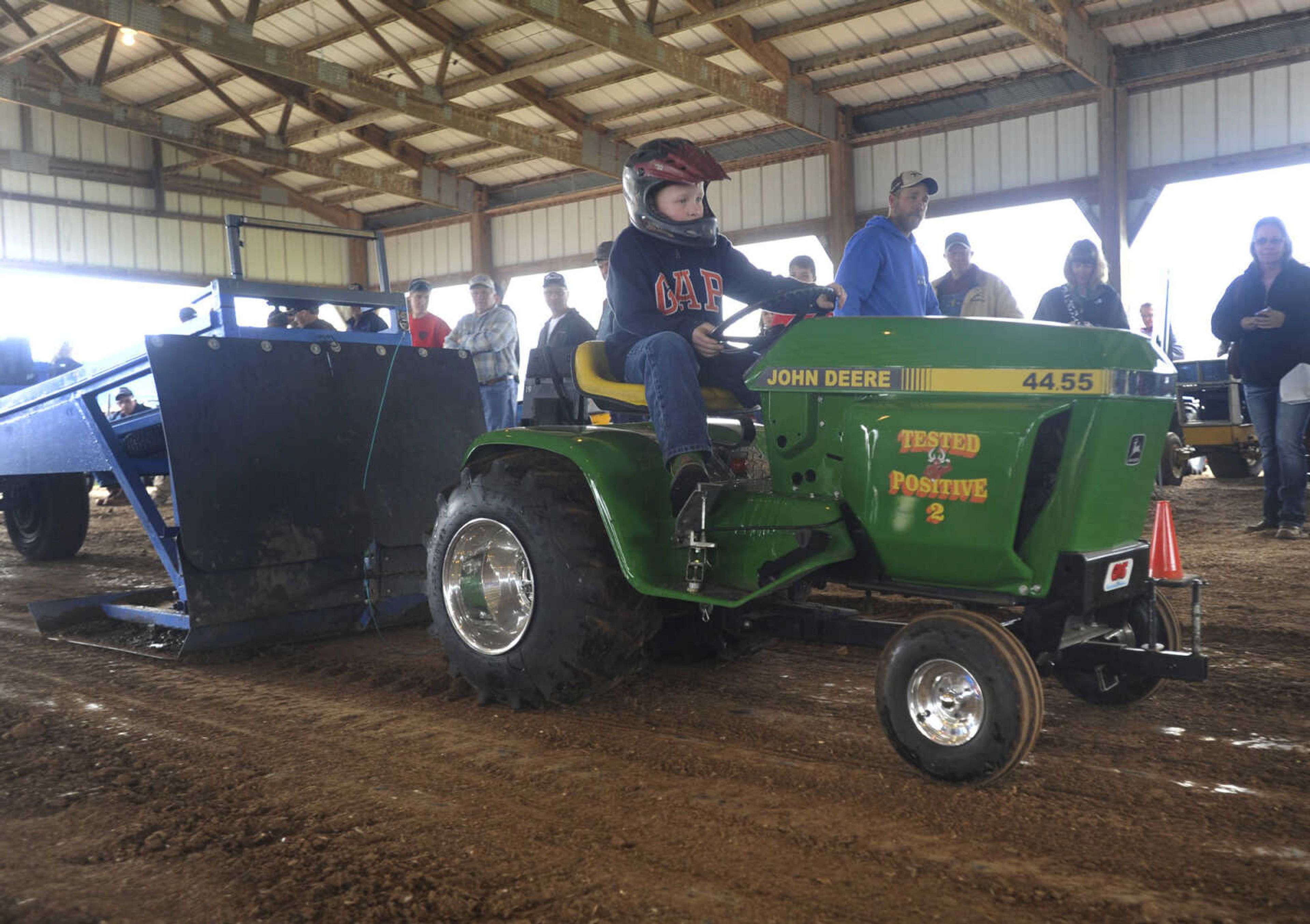 Allen Edler drives Tested Positive 2 in the lawn and garden tractor pull at the Cousin Carl Farm Show on Saturday, March 12, 2016 at Arena Park.