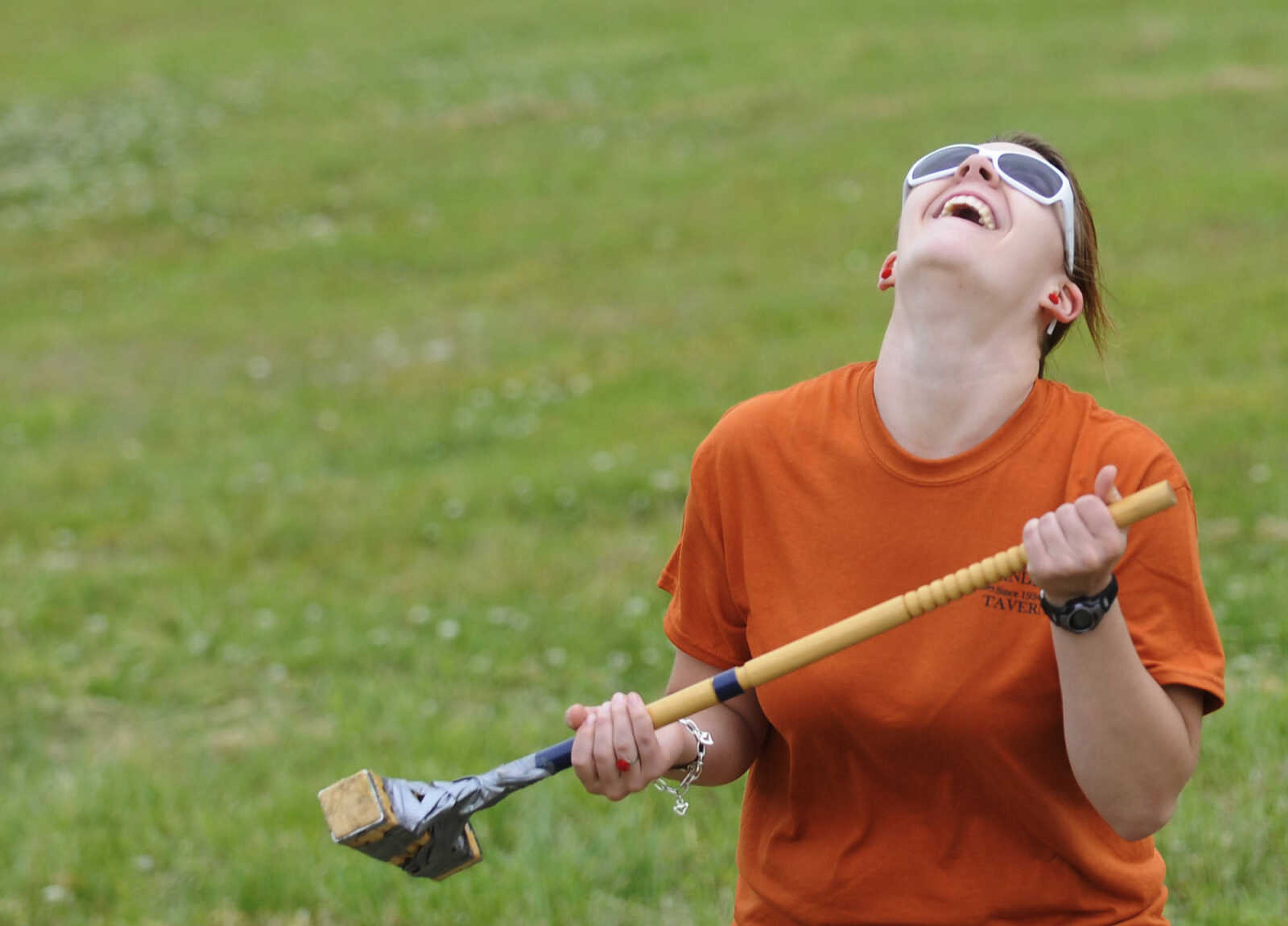 Whitney West reacts after just missing her put during the Kow Pasture Klassic at Schindler's Tavern in New Hamburg Saturday, April 28. Teams play a nine-hole course laid out in a pasture behind the tavern using tennis balls and a variety of objects as clubs, including tennis rackets, oars and mallets.