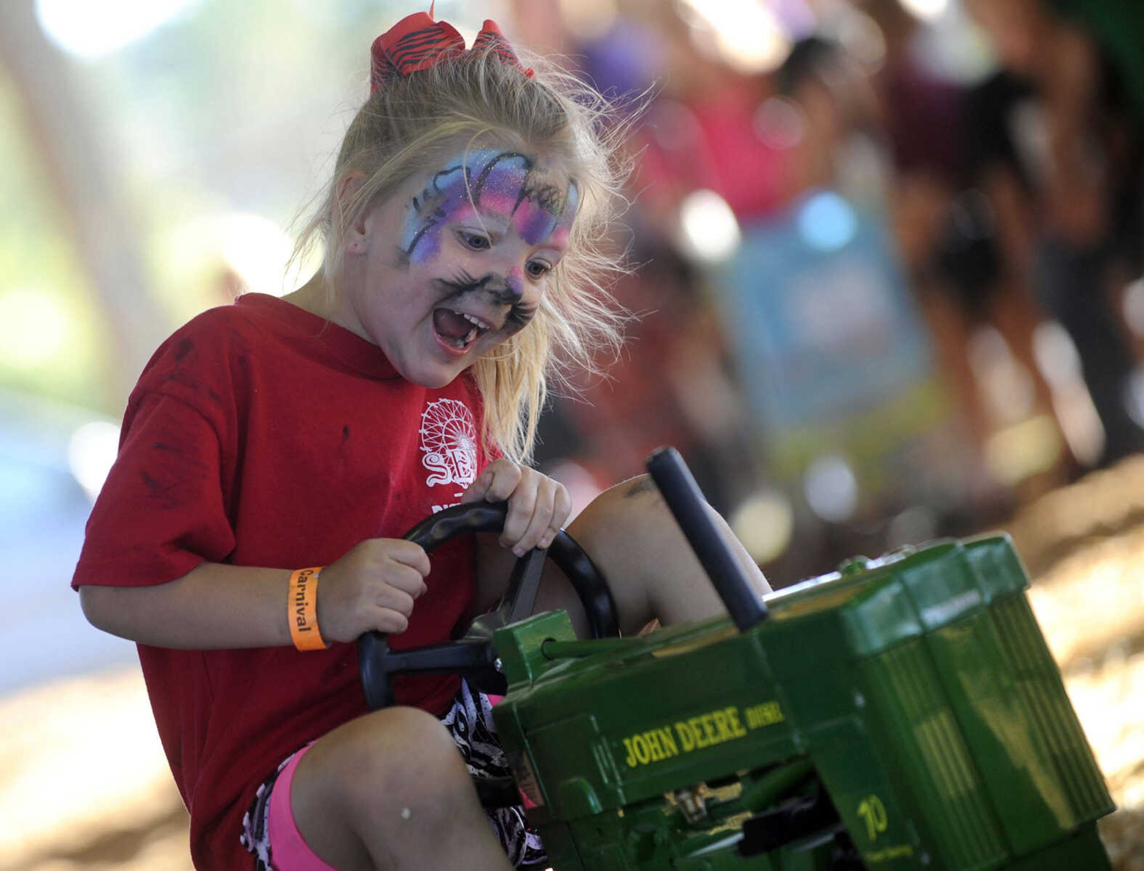 FRED LYNCH ~ flynch@semissourian.com
Danica Dewrock competes in the pedal tractor pull Saturday, Sept. 14, 2013 at the SEMO District Fair.