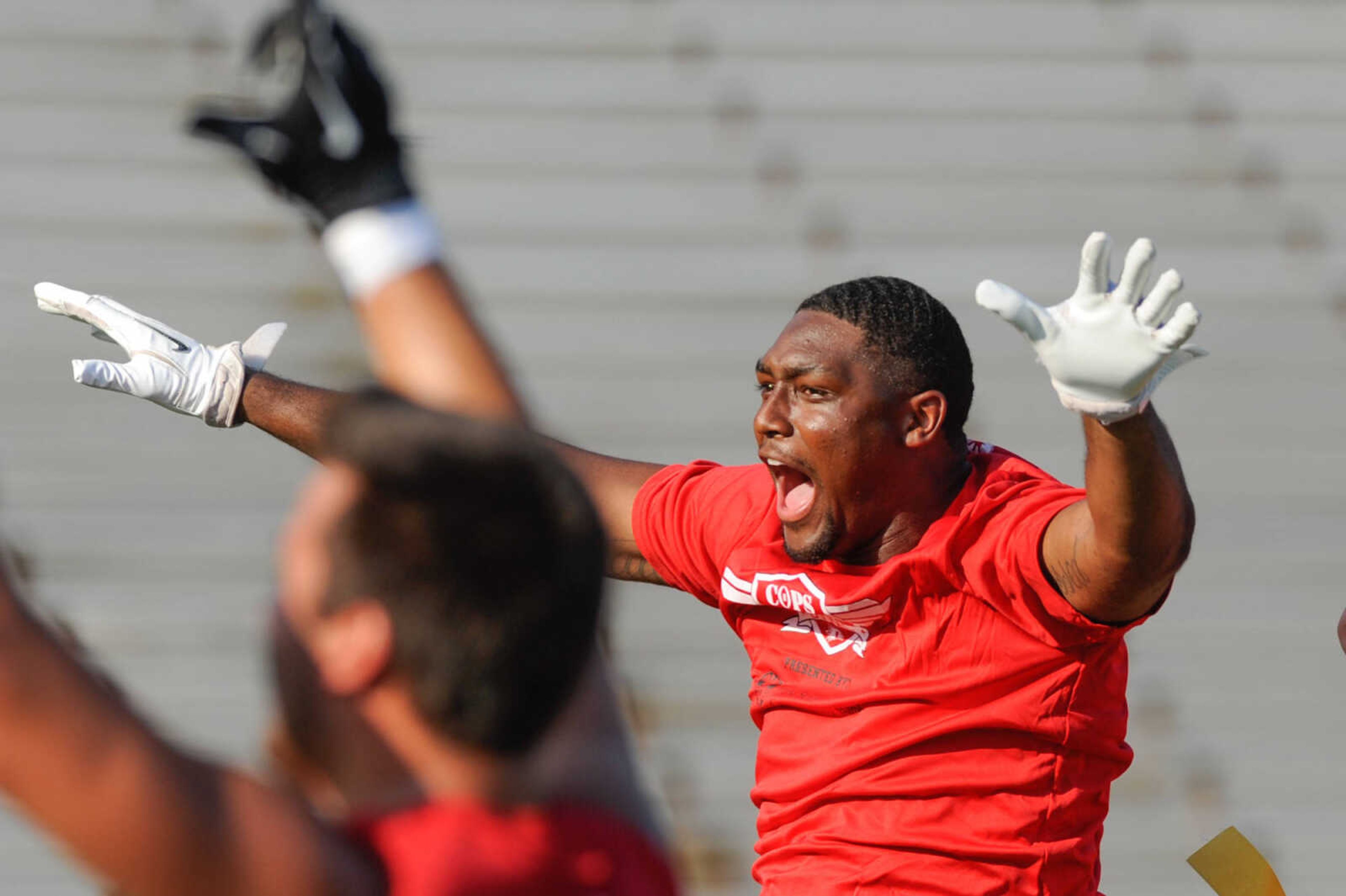 GLENN LANDBERG ~ glandberg@semissourian.com

Southeast Missouri State University football players celebrate a touchdown during the Cops and Hawks Bowl Thursday, July 21, 2016 at Houck Stadium. The flag-football game was a fundraiser for the family members of those who have lost their lives in the line of duty.