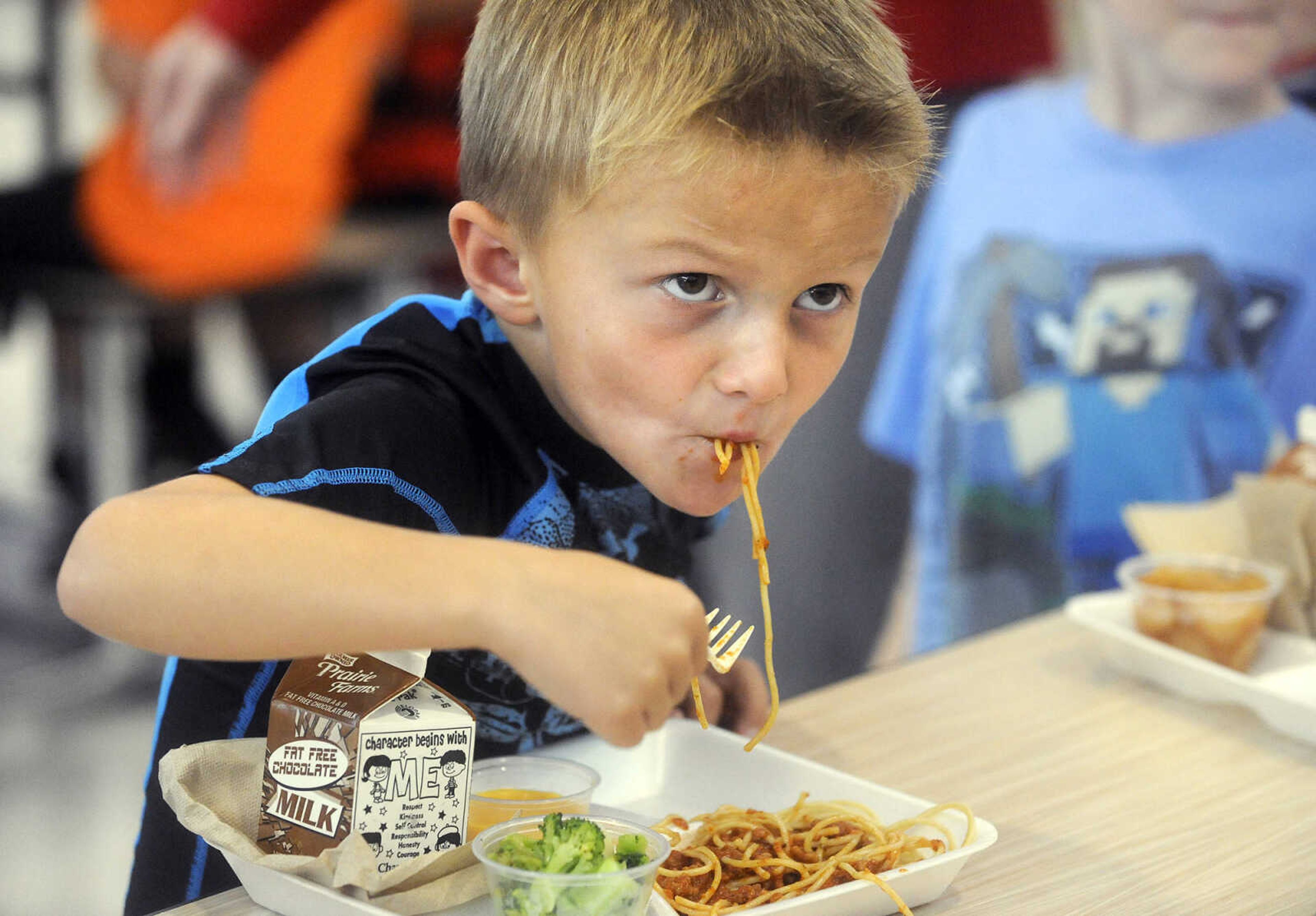 LAURA SIMON ~ lsimon@semissourian.com

Gunner Evans slurps up his spaghetti lunch, Tuesday, Oct. 13, 2015, at East Elementary in Jackson.