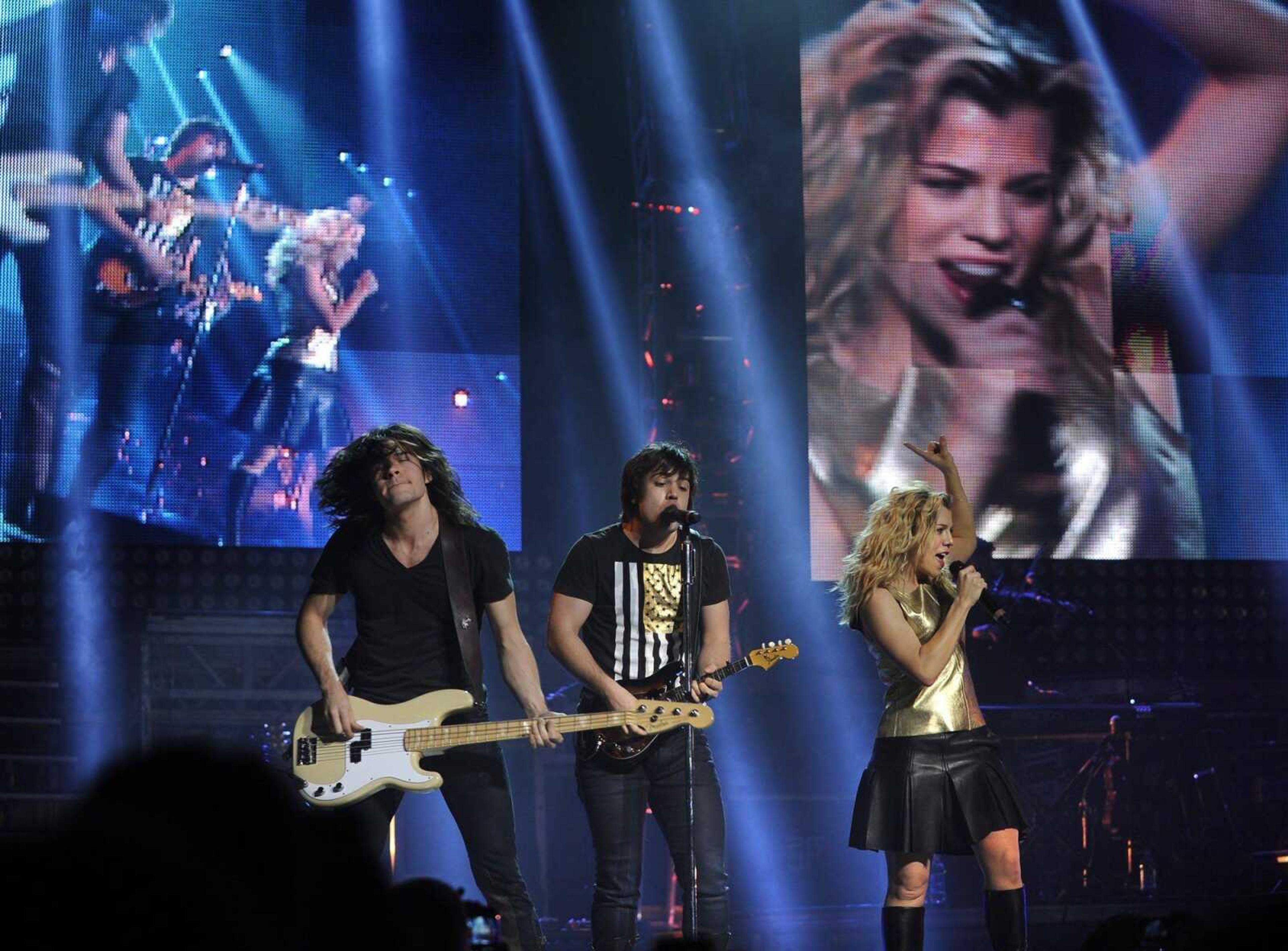 The Band Perry, with siblings Reid Perry on bass guitar, Neil Perry on mandolin and lead vocalist Kimberly Perry, performs Friday, Feb. 21, 2014 at the Show Me Center. More pictures from the concert, including Lindsay Ell and Easton Corbin, are in a gallery at semissourian.com. (Fred Lynch)