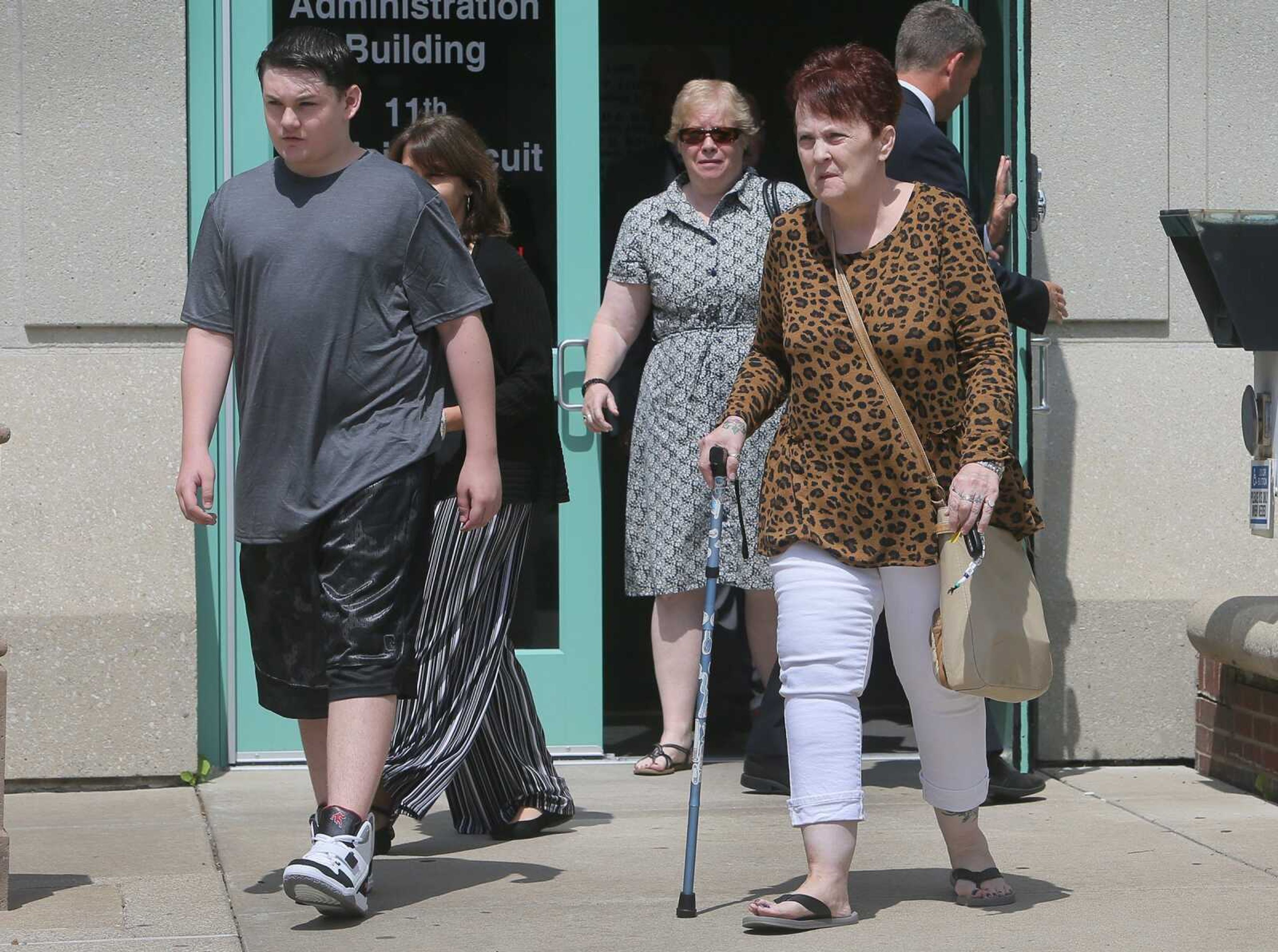 Trevelyan Gumpenberger, left, son of Louis Gumpenberger, and Margaret Burch, Louis Gumpenberger's mother leave the St. Charles County Courthouse on Monday in St. Charles, Missouri, after the sentencing of Pamela Hupp to life in prison for the murder of Louis Gumpenberger.