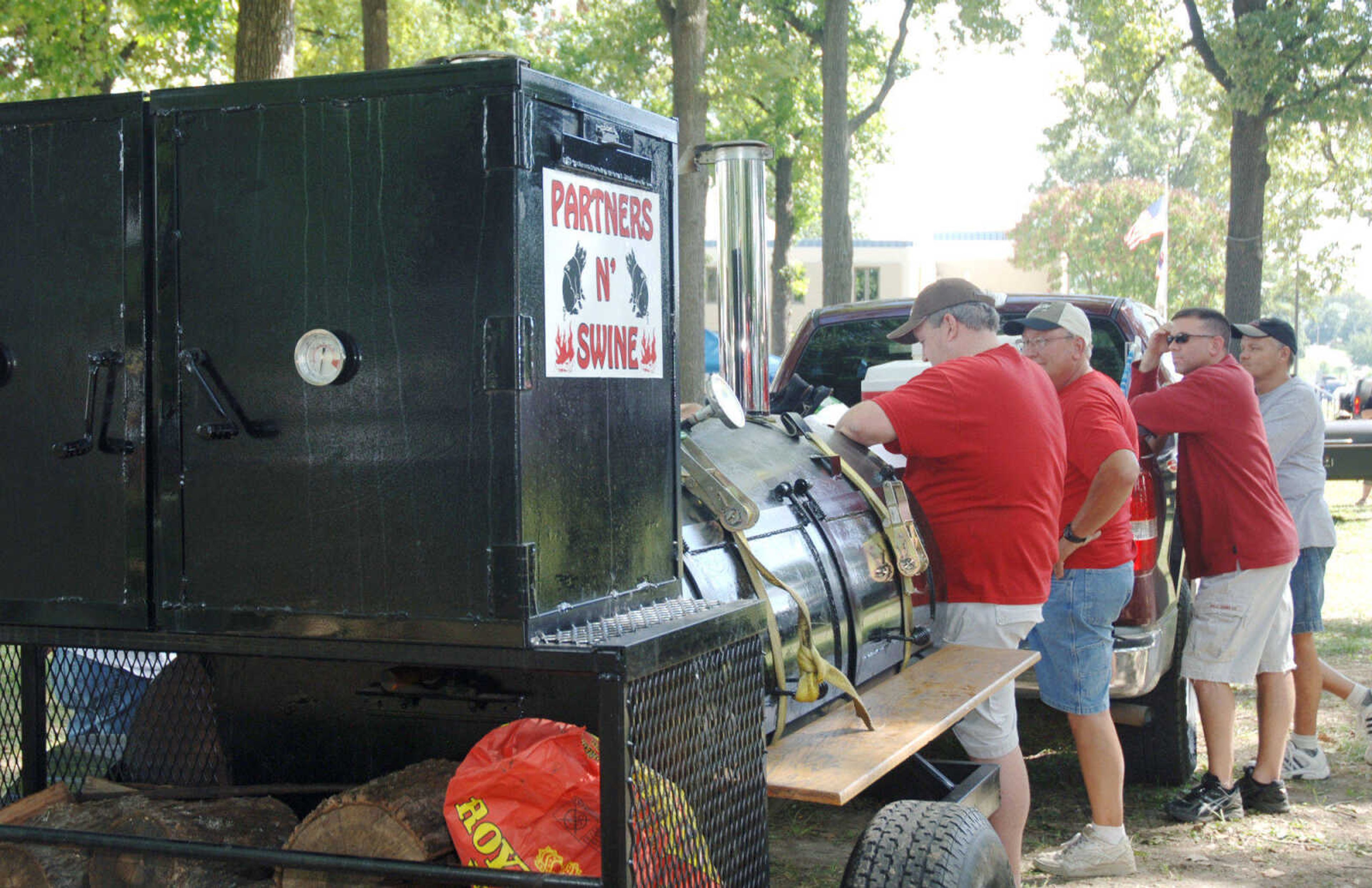 The Partners in Swine await the results of the Cape BBQ Fest held at Arena Park on Saturday, August 22, 2009.