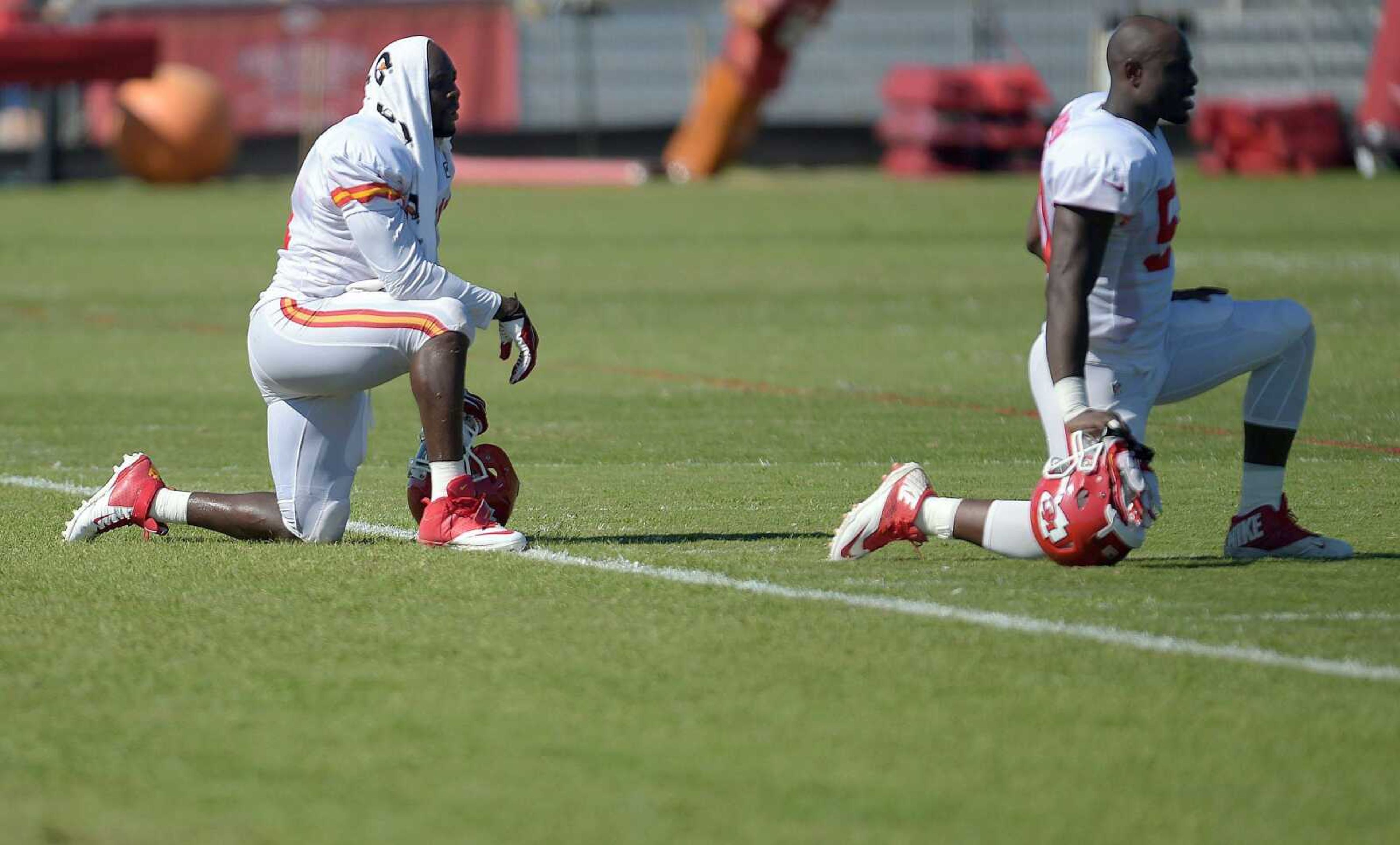 The Kansas City Chiefs' Tamba Hali, left, and Justin Houston rest between drills during practice Wednesday morning on the Missouri Western State University campus in St. Joseph. Mo. (Todd Weddle ~ St. Joseph News-Press)