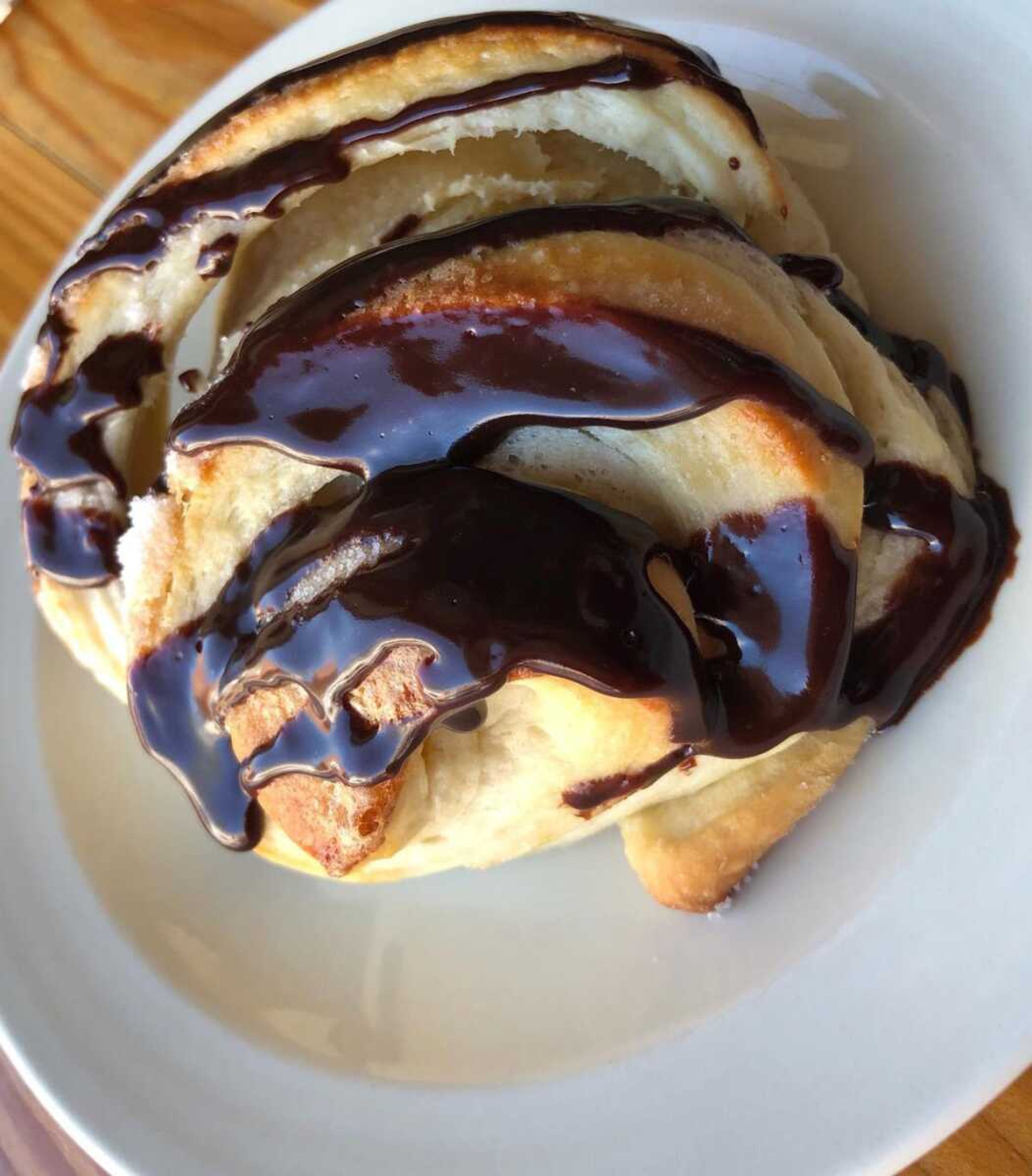 The fresh baked chocolate drizzled croissant is a pastry lovers dream.