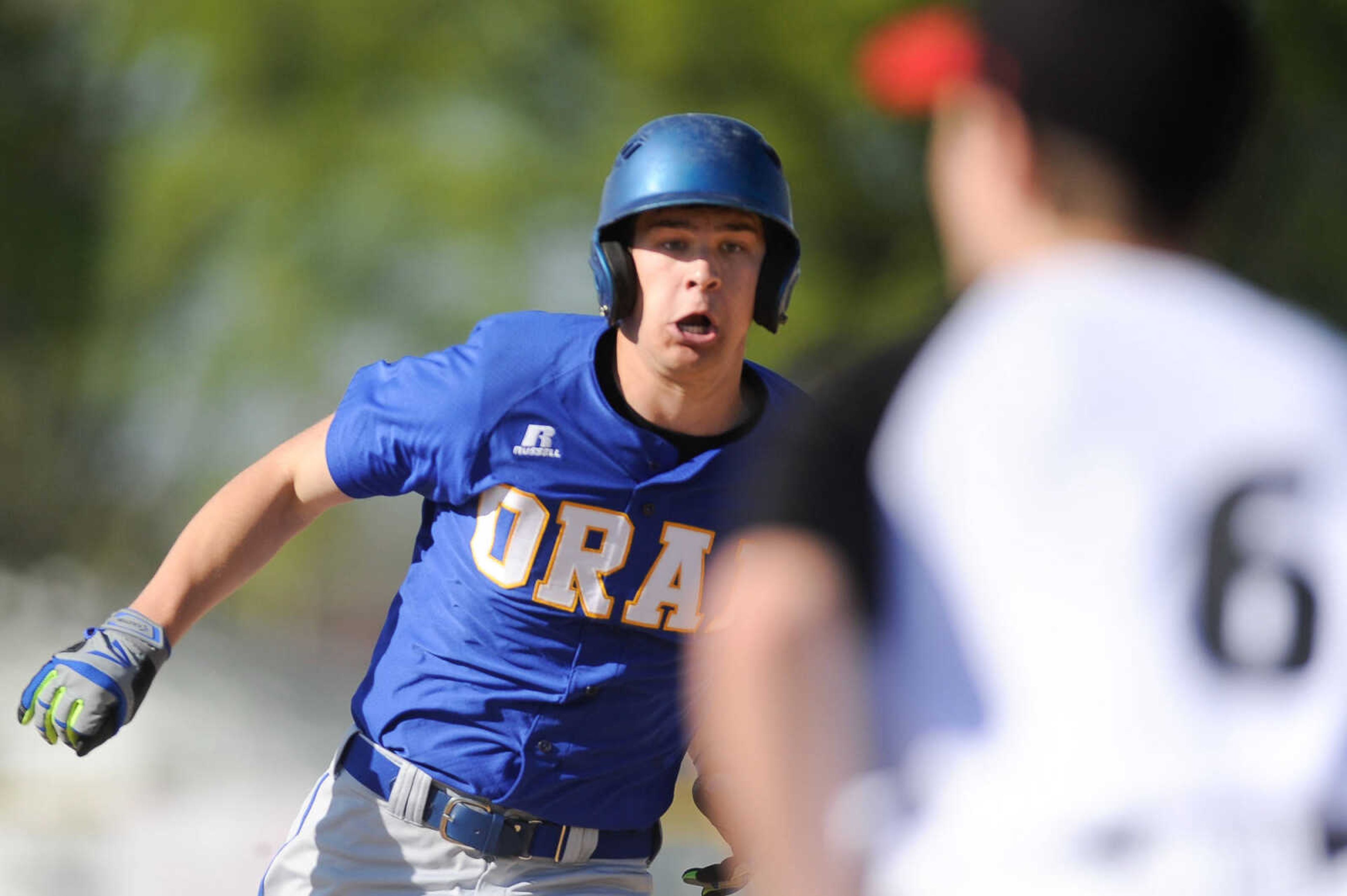 Oran's Drew Reischman makes his way to third base with a slide past Chaffee's Breven Yarbro during the second inning Friday, April 15, 2016 in Chaffee Missouri.