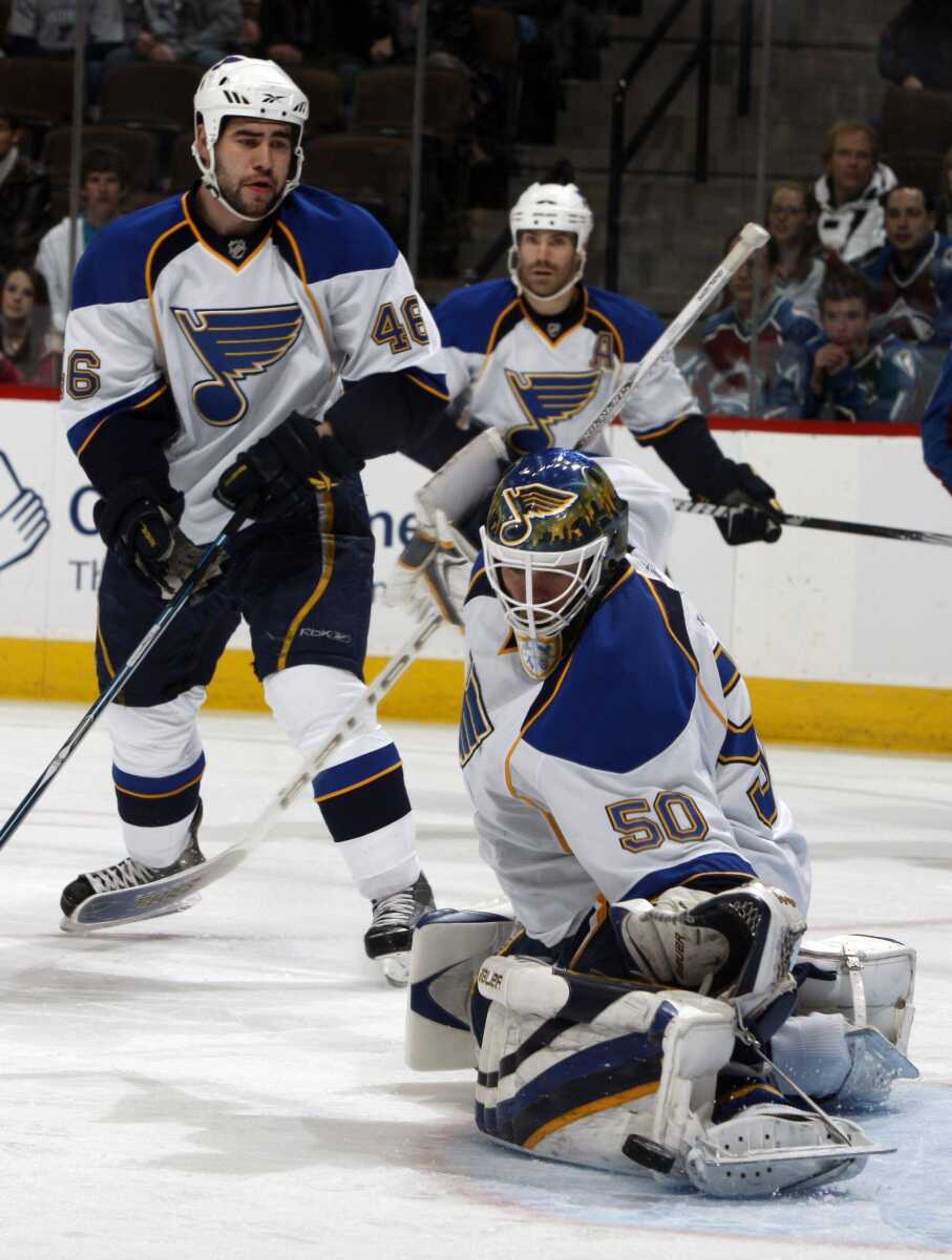 Blues goalie Chris Mason misses a shot by the Avalanche's Milan Hejduk as Blues defensemen Roman Polak, left, and Barret Jackman look on during the first period Saturday in Denver. The shot went in the net. (David Zalubowski ~ Associated Press)