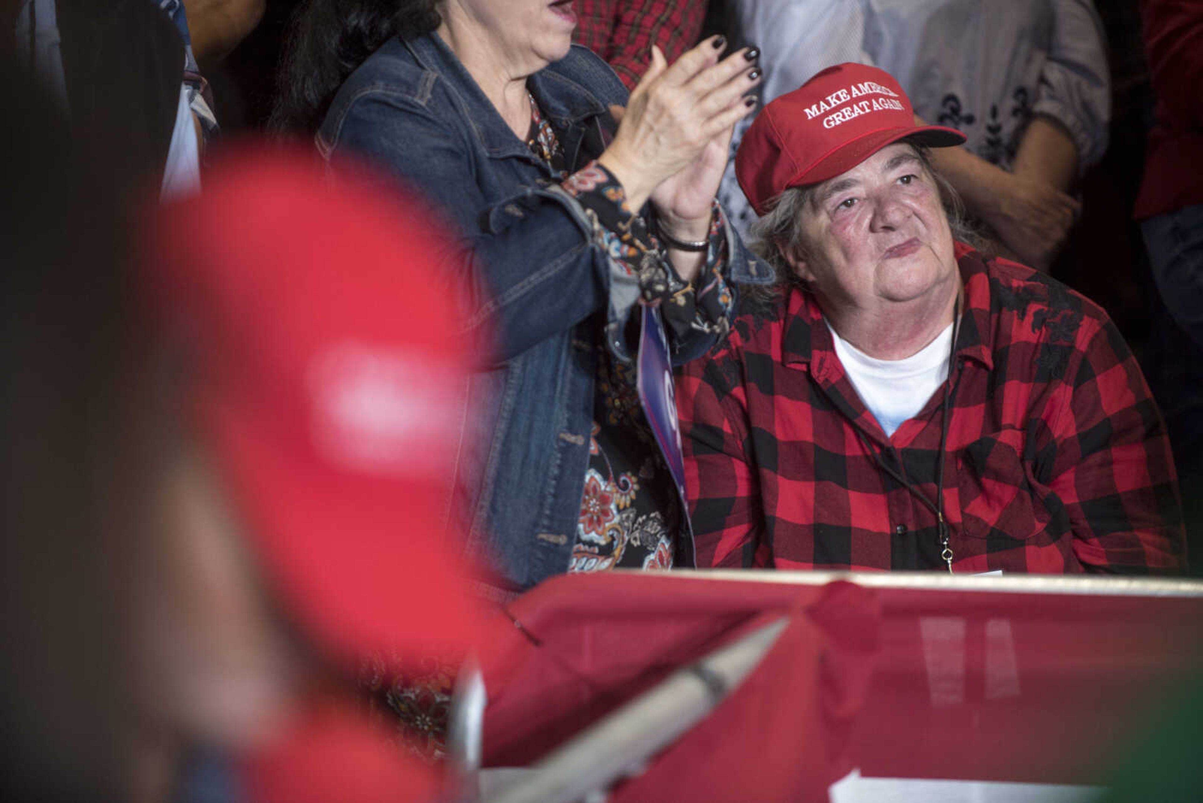 A Trump supporter listens to President Donald Trump's speech at a Make America Great Again rally Monday, Nov. 5, 2018, at the Show Me Center in Cape Girardeau.