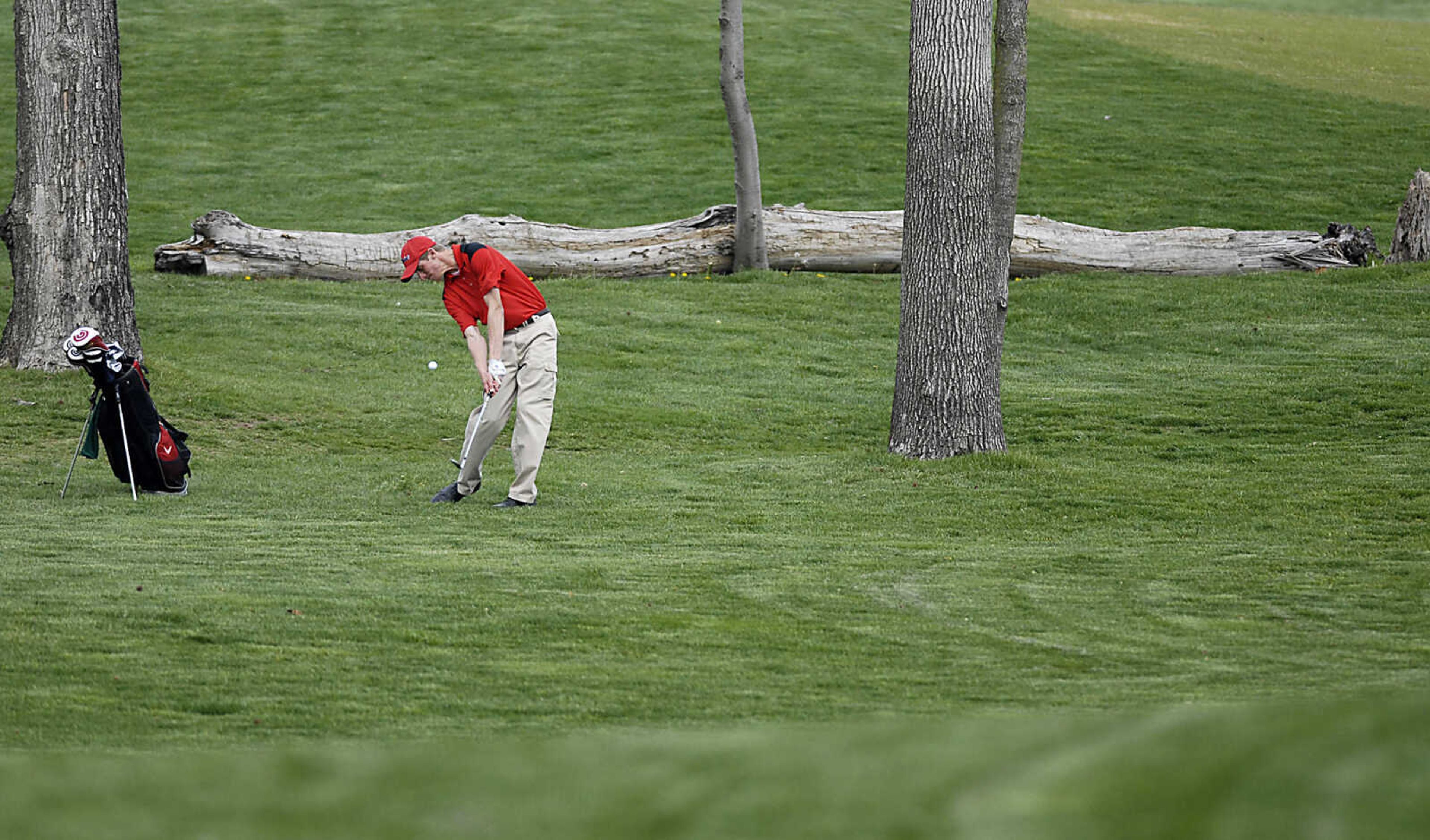 KIT DOYLE ~ kdoyle@semissourian.com
Dexter's Jon Bowman takes an iron shot on the first fairway Thursday, April 16, 2009, during the Saxony Lutheran Invitational at Dalhousie Golf Club in Cape Girardeau.