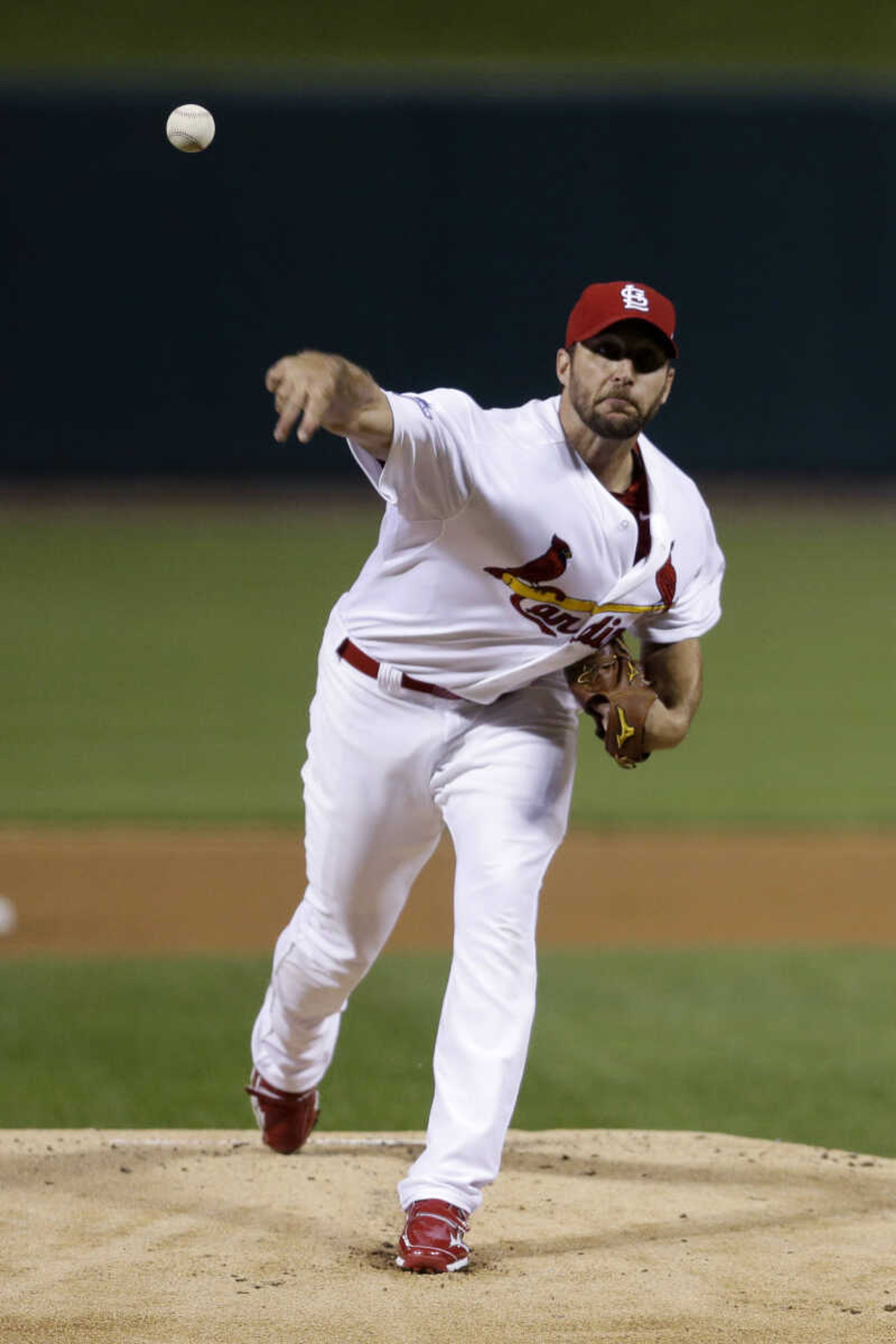 St. Louis Cardinals starter Adam Wainwright pitches against the Pittsburgh Pirates in the first inning of Game 5 of a National League baseball division series on Wednesday, Oct. 9, 2013, in St. Louis. (AP Photo/Jeff Roberson)