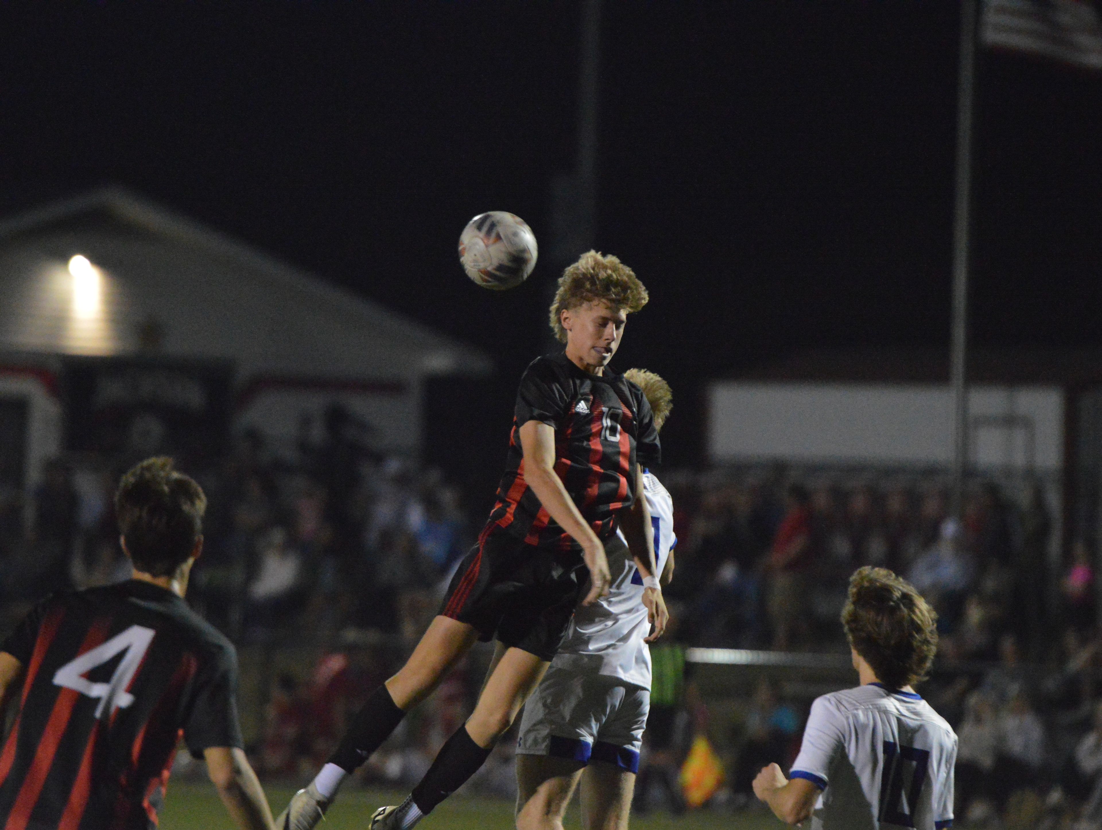 Jackson junior Mason Jackson heads the ball against Notre Dame on Tuesday, Oct. 29.