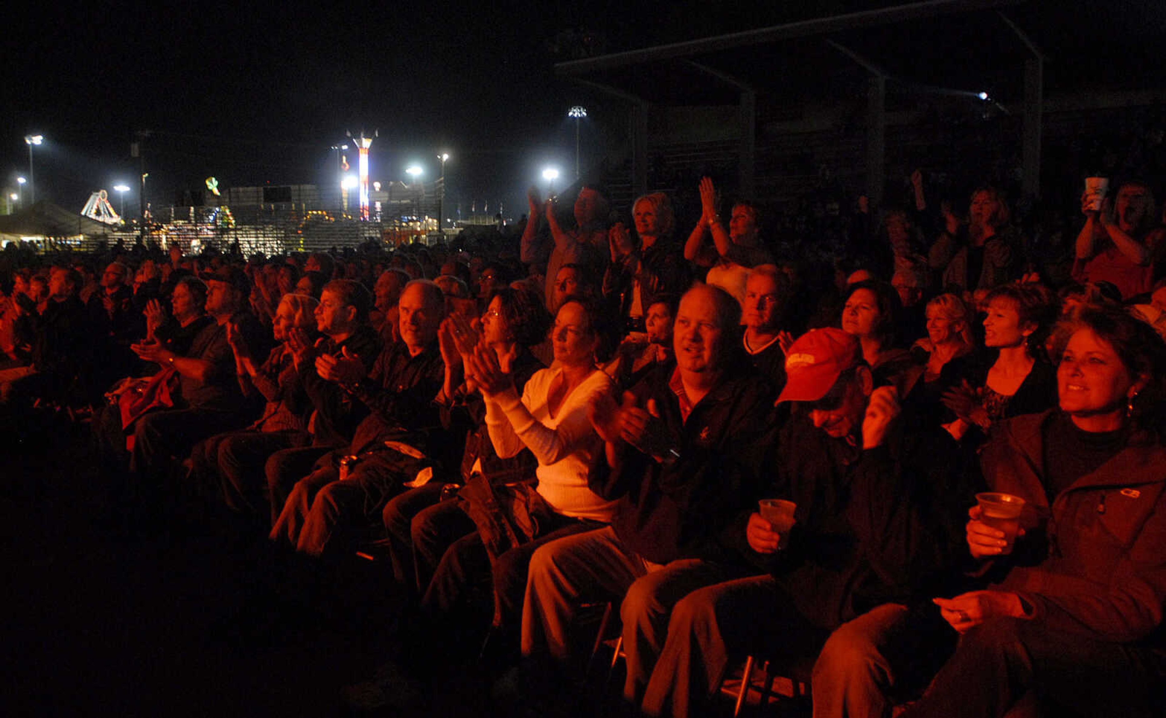 LAURA SIMON ~ lsimon@semissourian.com
Creedence Clearwater Revisited rocks the grandstand at Arena Park Friday, September 16, 2011 during the SEMO District Fair in Cape Girardeau.