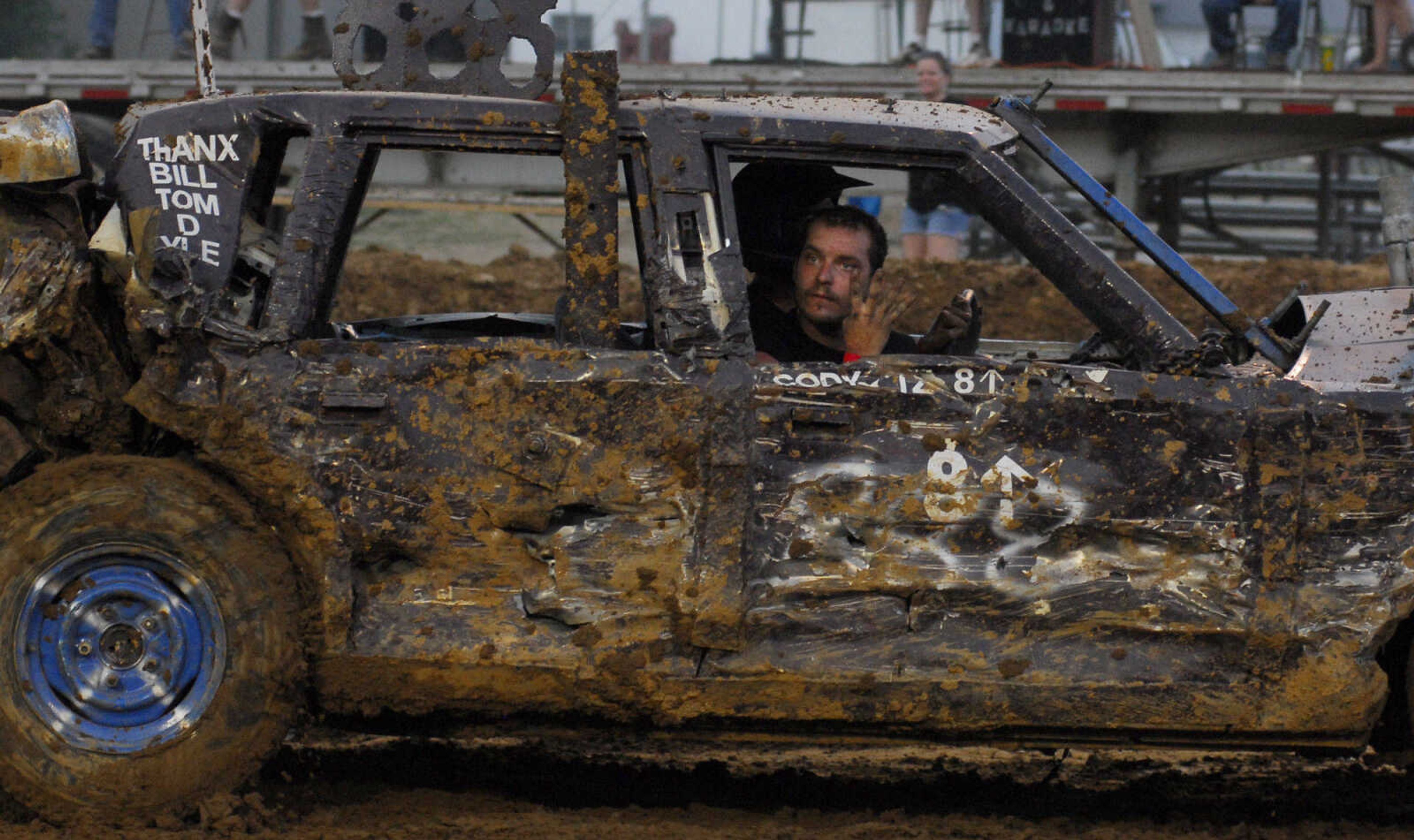 LAURA SIMON~lsimon@semissourian.com
A passenger in the dual demolition derby looks towards the crowd during the U.S.A. Veterans Fourth of July celebration at Arena Park in Cape Girardeau Sunday, July 4, 2010.