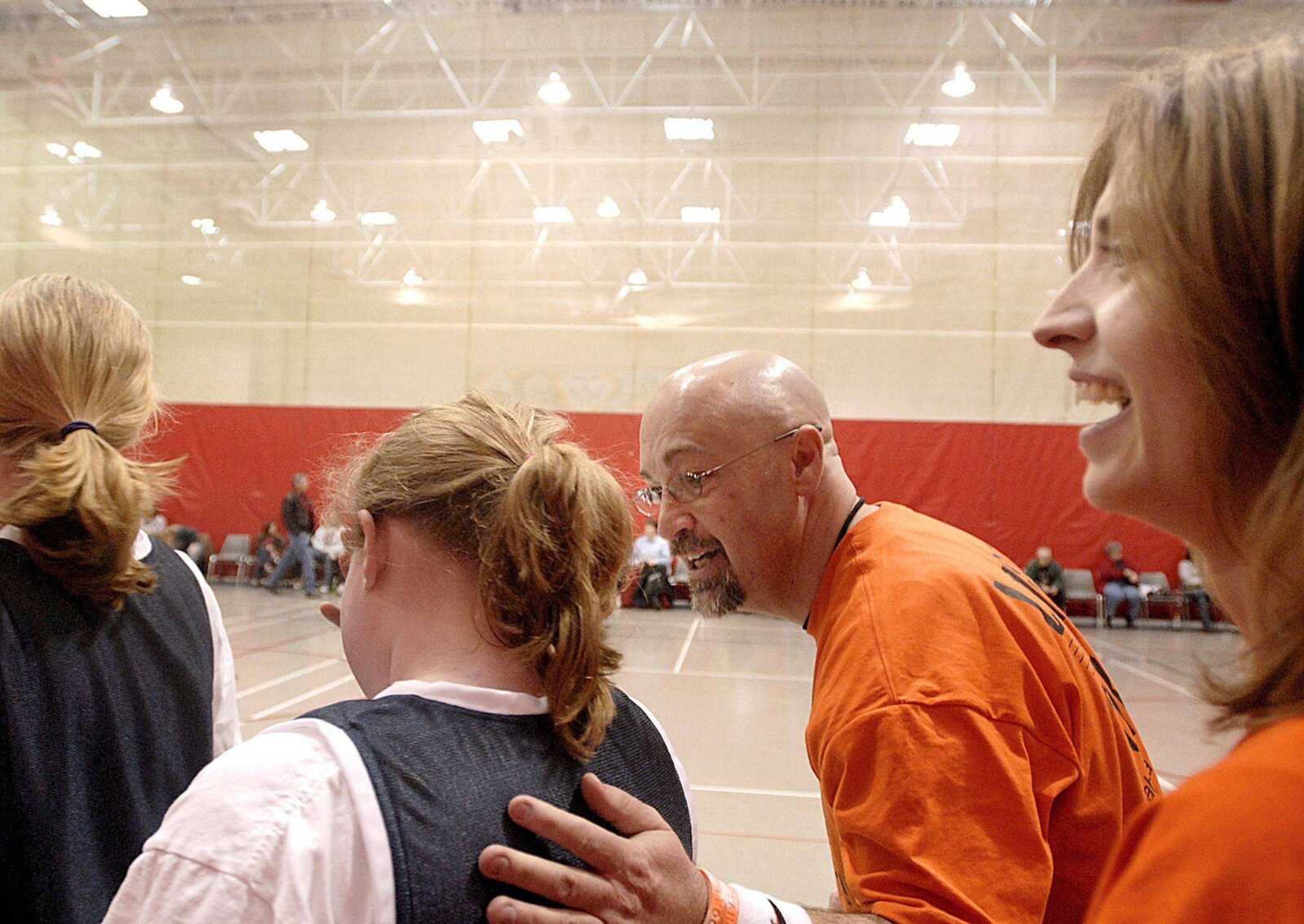 Shannon and Amy Aldridge congratulate their girls basketball team after winning the final game of the season, leaving them undefeated on Saturday, February 23, 2008 at the Southeast Missouri State University Rec Center. The team had decided to dedicate the season to the Aldridges' daughter Sahara, who died in November. (Aaron Eisenhauer)