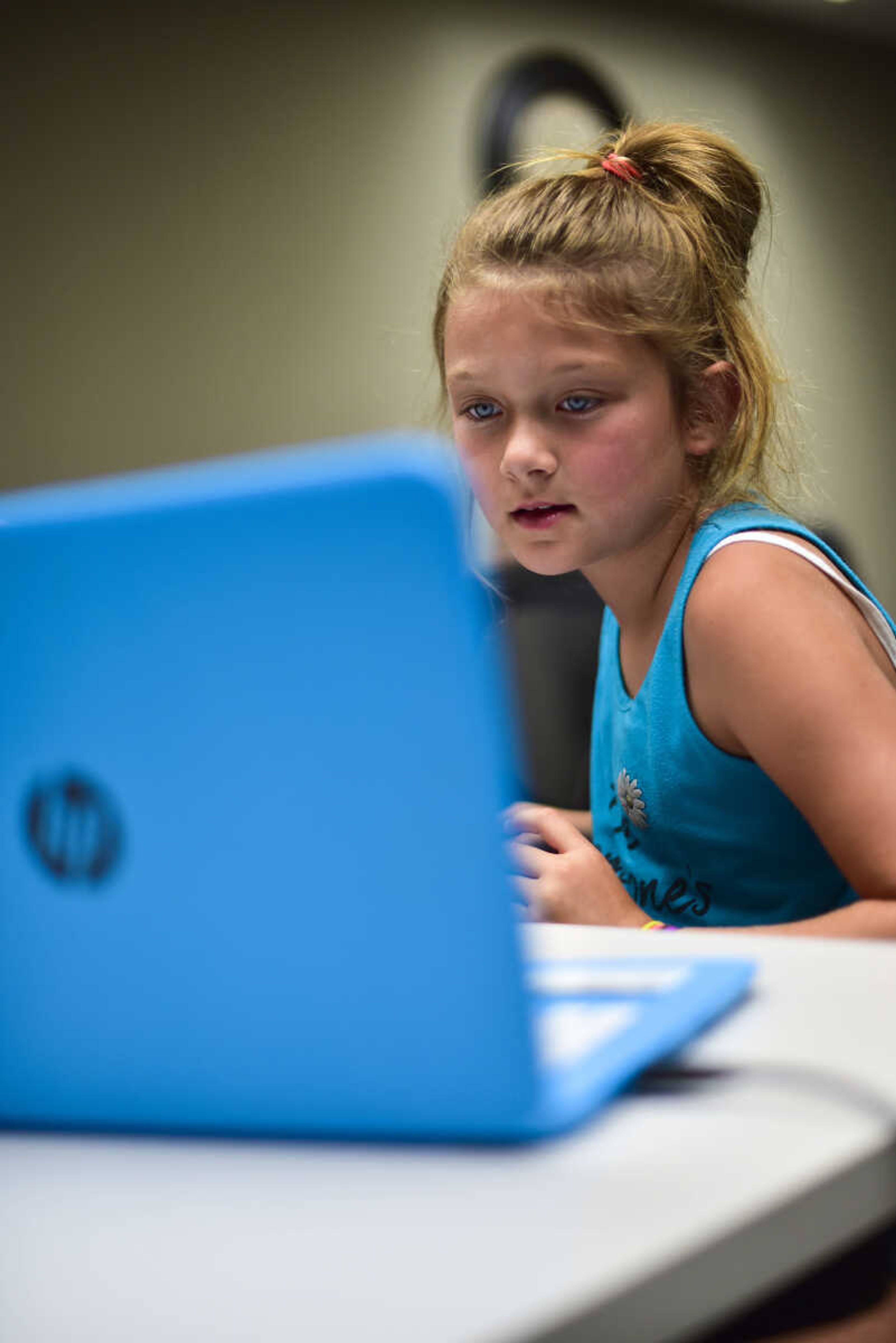 Ava Wessell looks at the computer screen during the Code Camp: Coding with The Finch with the Marquette Technology Institute Monday, July 17, 2017 in Cape Girardeau.