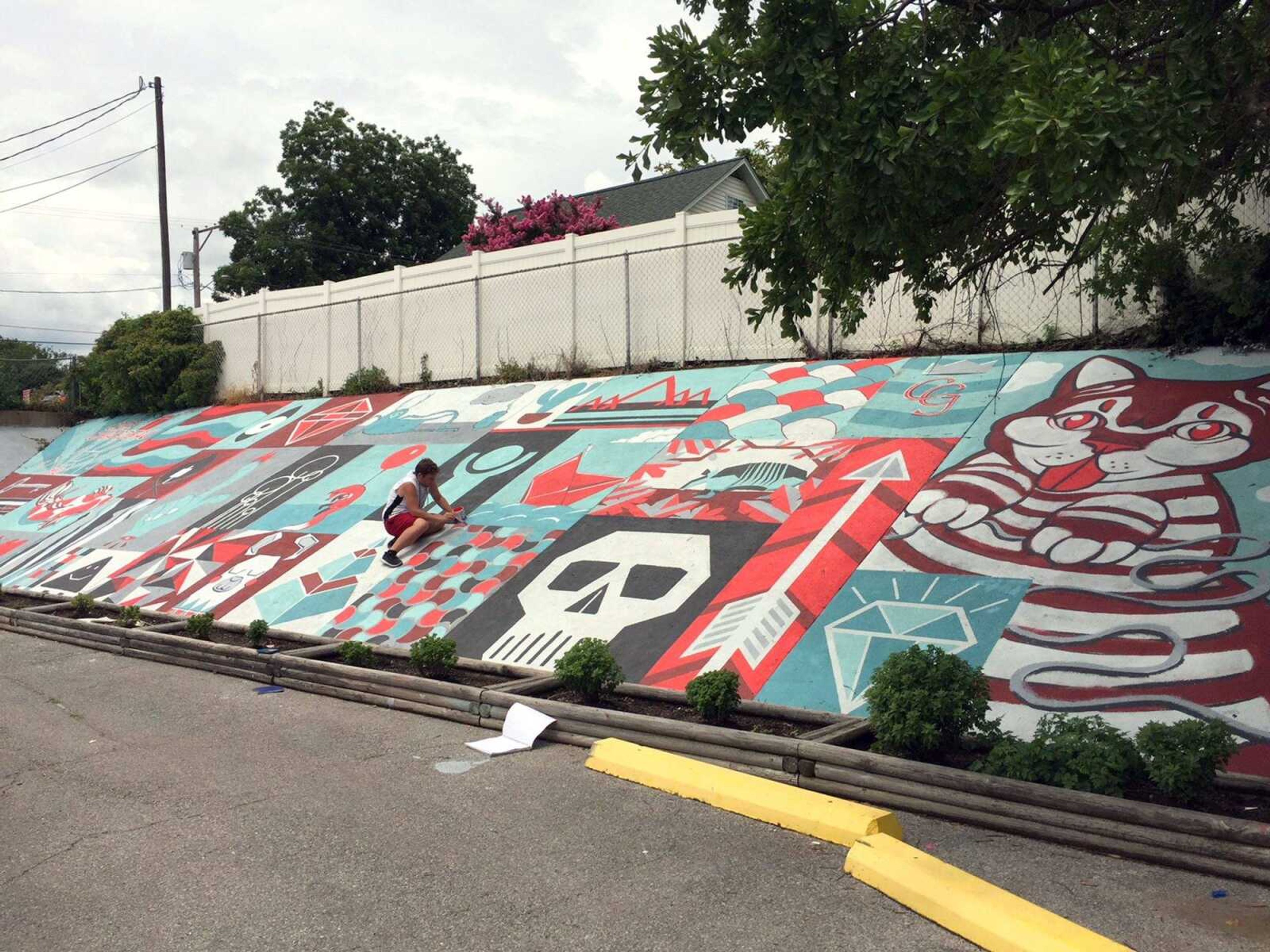 Southeast Missouri State University art students complete a mural at Stevie's Steakburger in Cape Girardeau.