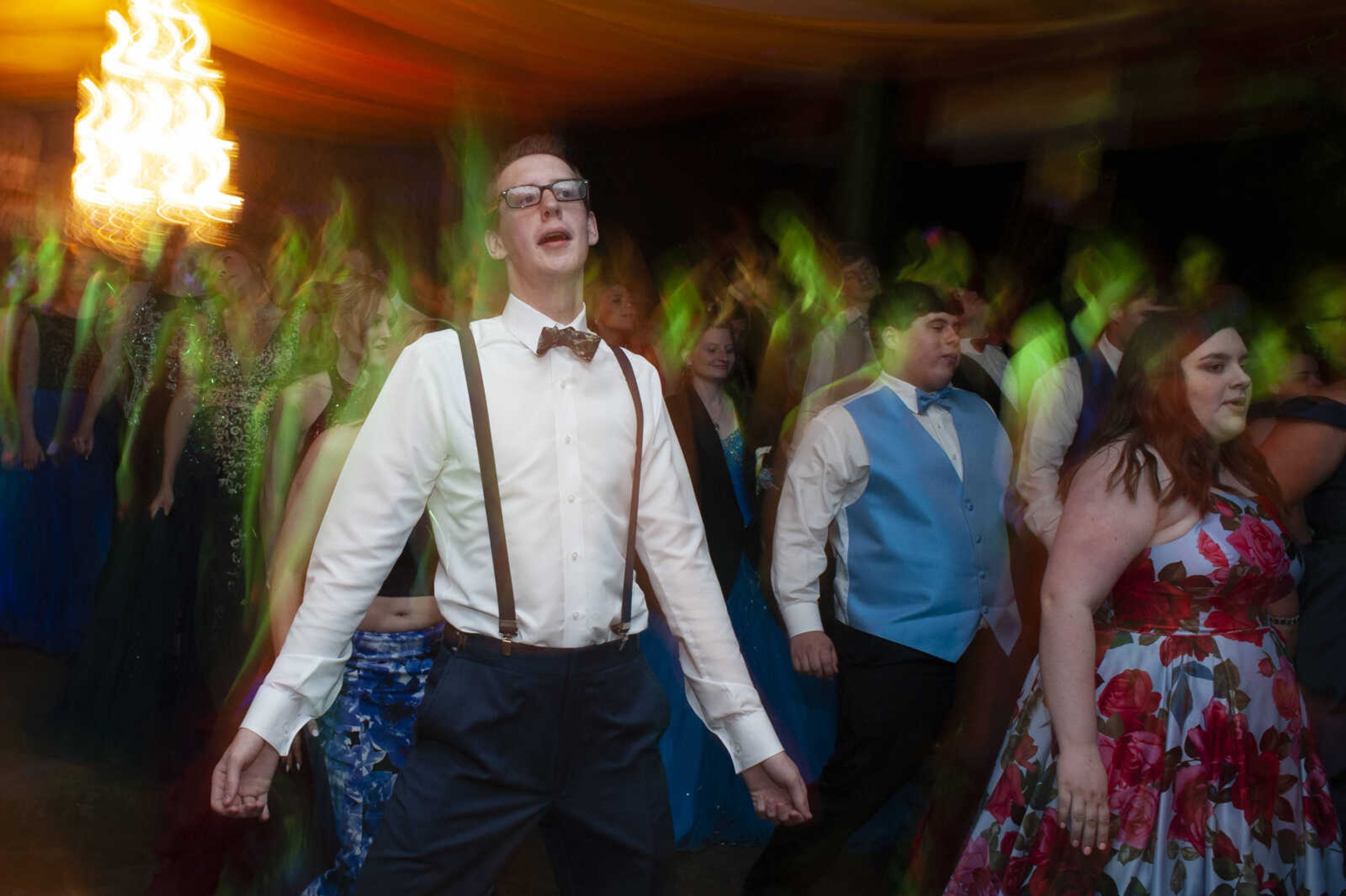 Meadow Heights senior Kage Fernalld dances during Leopold High School's "Masquerade at Midnight" prom Saturday, April 27, 2019, in Leopold.