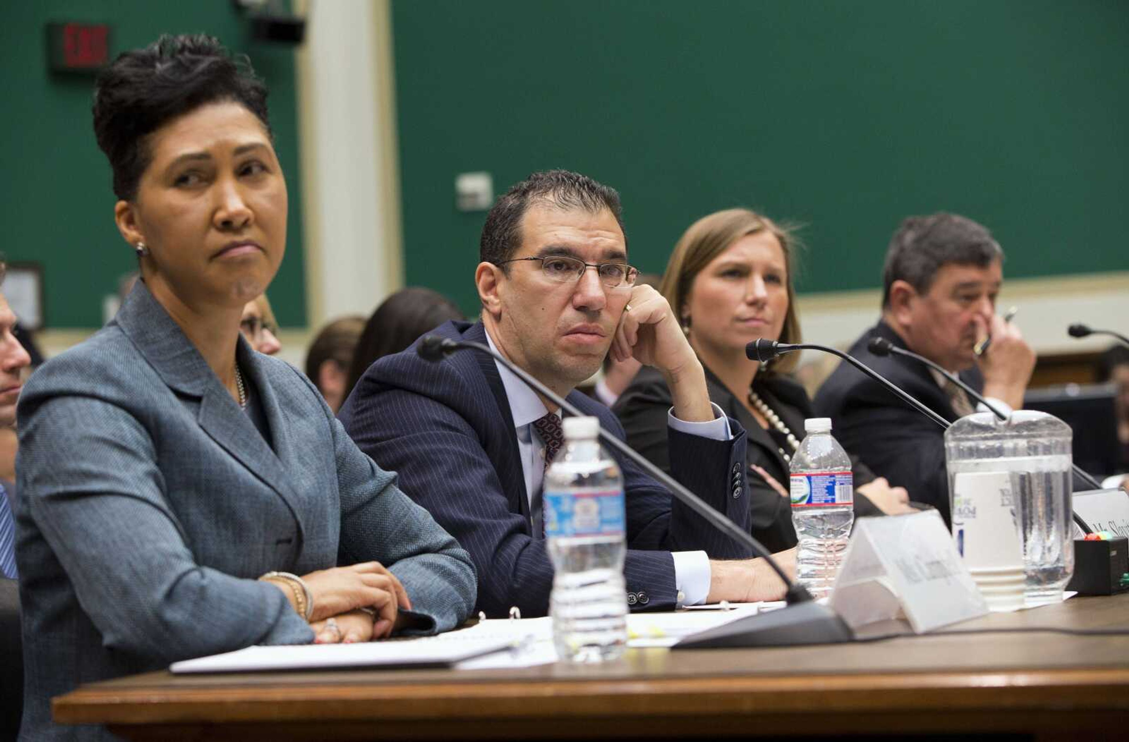 From left, Cheryl Campbell, senior vice president of CGI Federal; Andrew Slavitt, group executive vice president for Optum/QSSI; Lynn Spellecy, corporate counsel for Equifax Workforce Solutions; and John Lau, program director for Serco, listen to questioning Thursday on Capitol Hill in Washington during a House Energy and Commerce Committee hearing with contractors that built the federal government&#8217;s health care websites. (Evan Vucci ~ Associated Press)