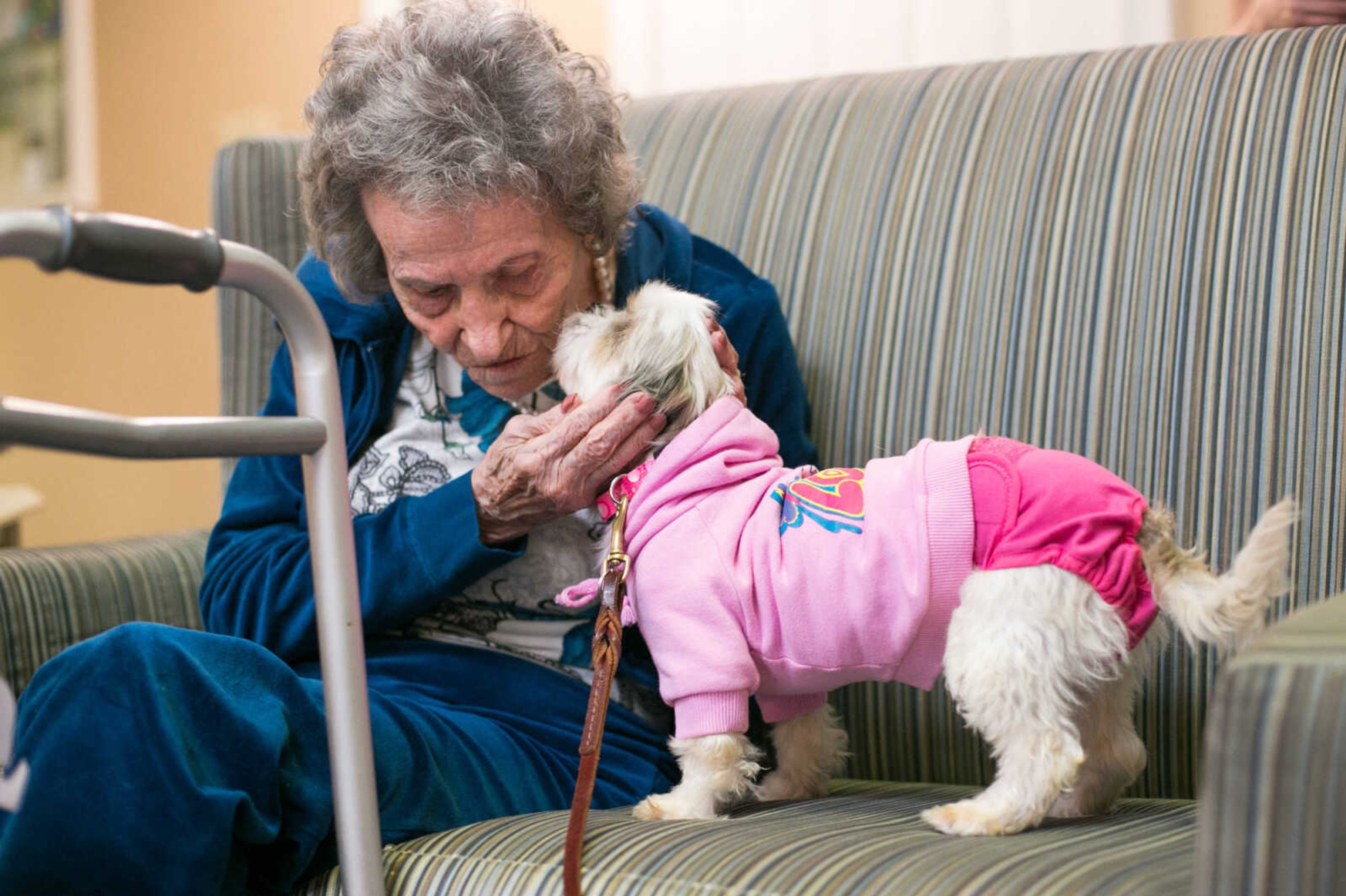 GLENN LANDBERG ~ glandberg@semissourian.com

Helen Wolters spends a moment with Rosie Thursday afternoon, Jan. 14, 2016 at The Arbors at Auburn Creek by Americare in Cape Girardeau. Dogs dressed in their finest clothing visited with residents during National Dress Up Your Pet Day.