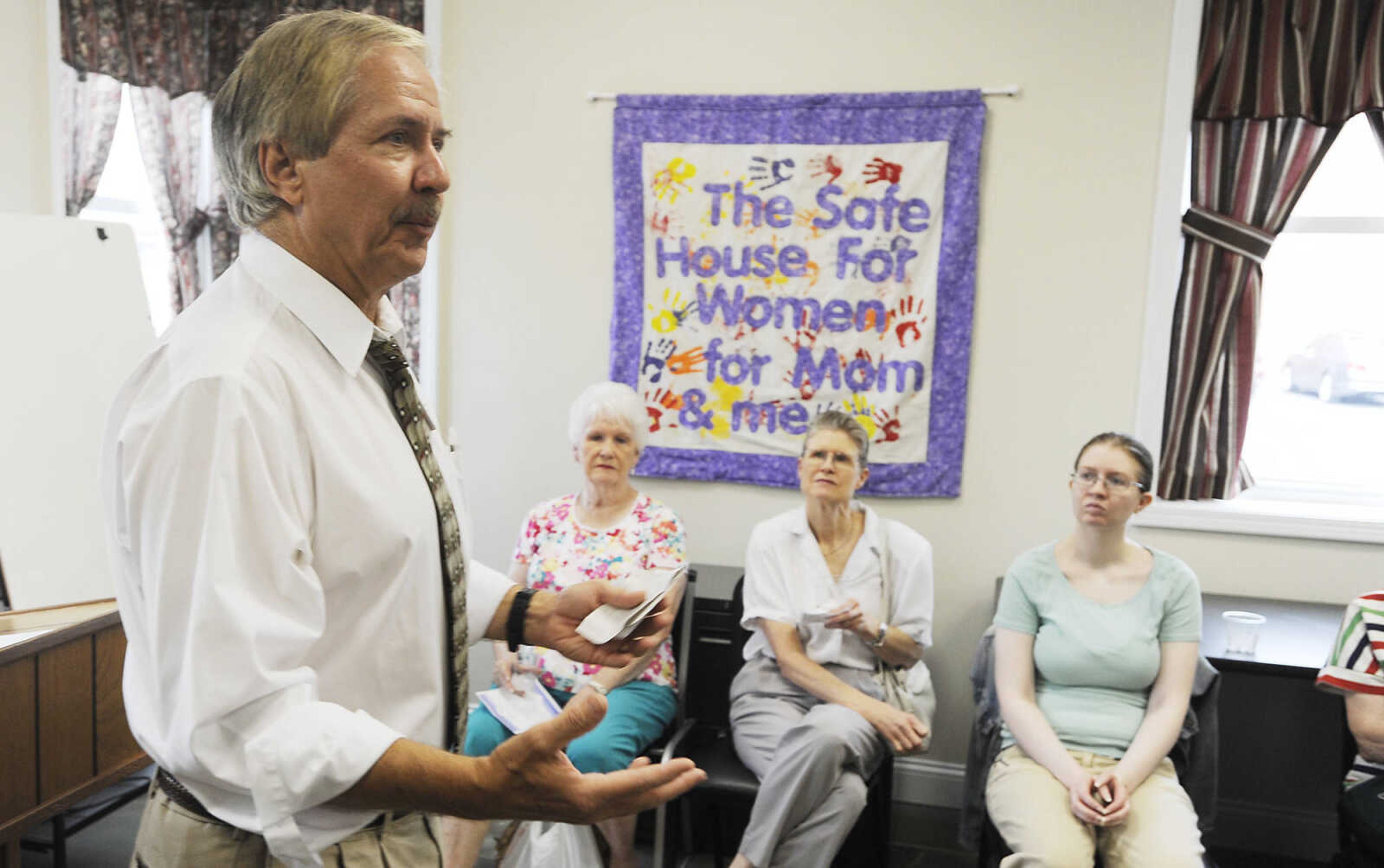 Safe House Board of Directors president Rick Althaus speaks during a community open house Tuesday, August 14, at their Outreach Center, 230 N. Spring St.