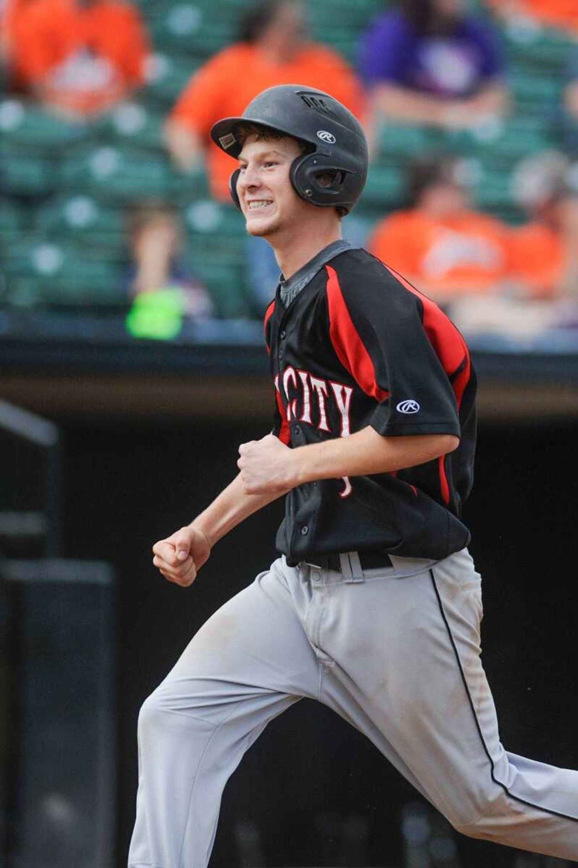 Bell City's Jesse Smith celebrates as he crosses home in the second inning against Northwest during a Class 1 semifinal, Tuesday, June 2, 2015 in O Fallon, Missouri. (Glenn Landberg)