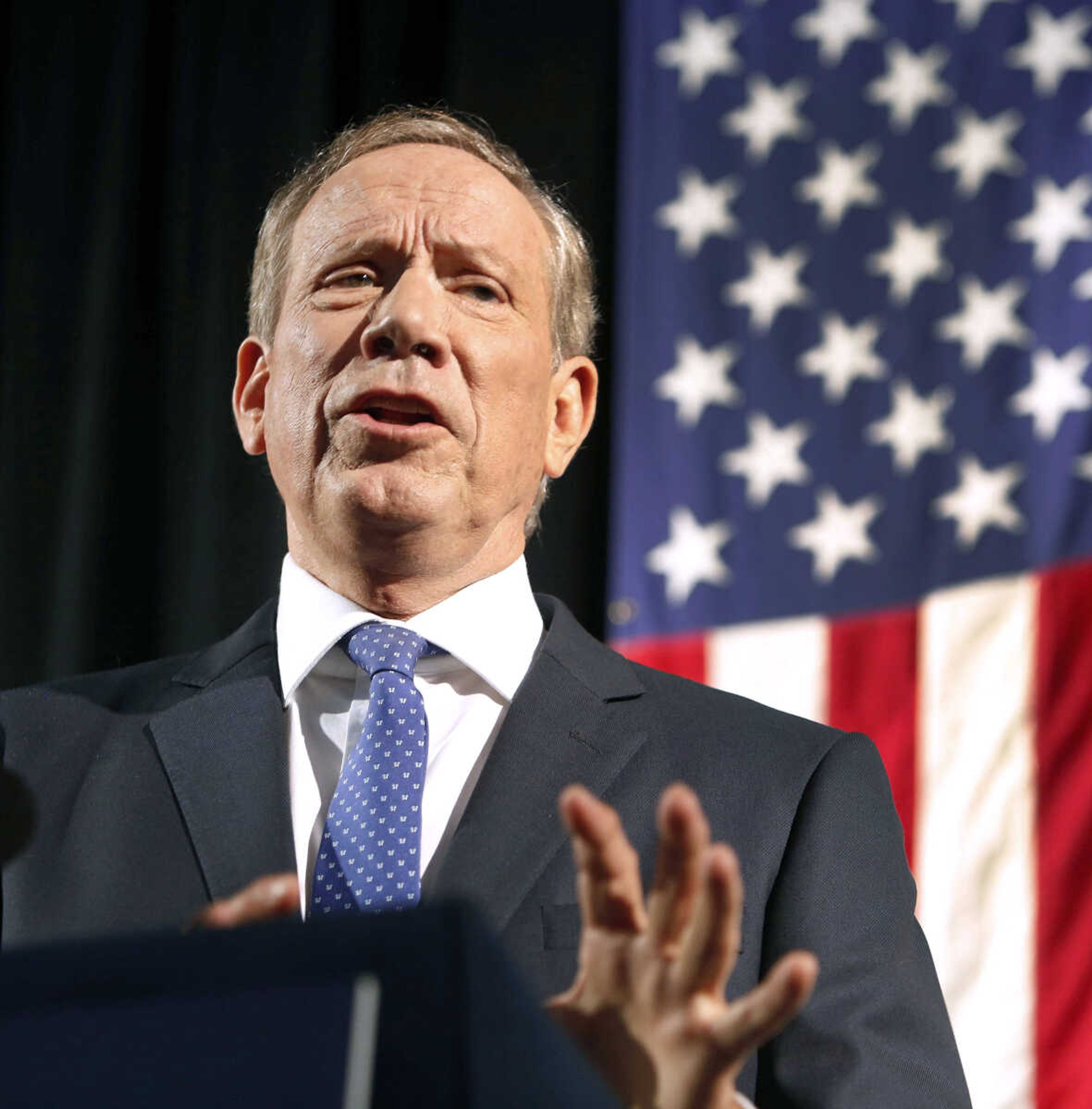 Former New York governor George Pataki announces his plans to seek the Republican nomination for president Thursday at the historic town hall in Exeter, New Hampshire. (Jim Cole ~ Associated Press)