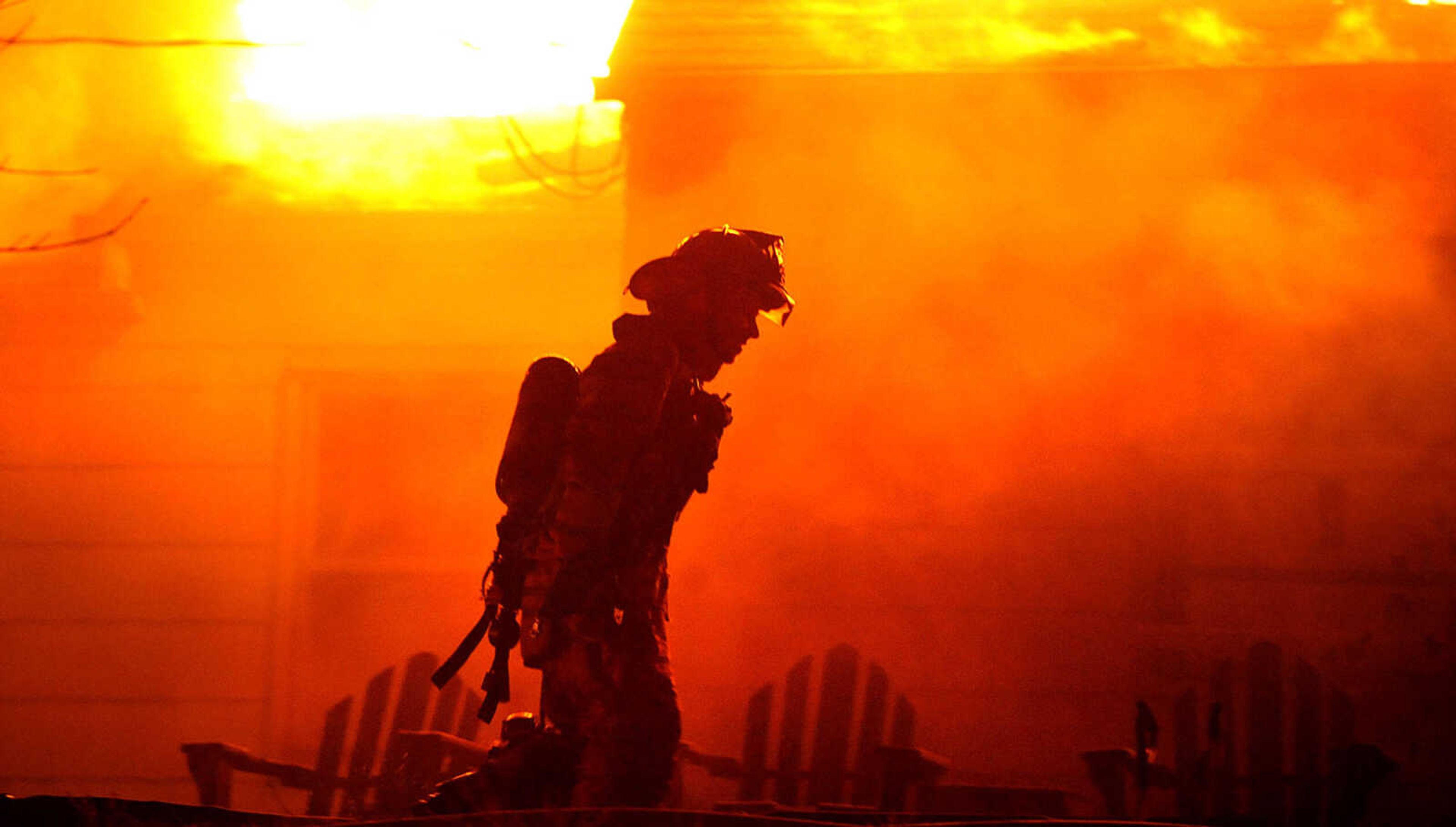 LAURA SIMON ~ lsimon@semissourian.com
Firefighters from Delta, Gordonville, Cape Girardeau, Millersville, Fruitland and East County Fire Departments battle a structure fire Wednesday night, January 9, 2012 on Onyx Lane in Cape Girardeau.