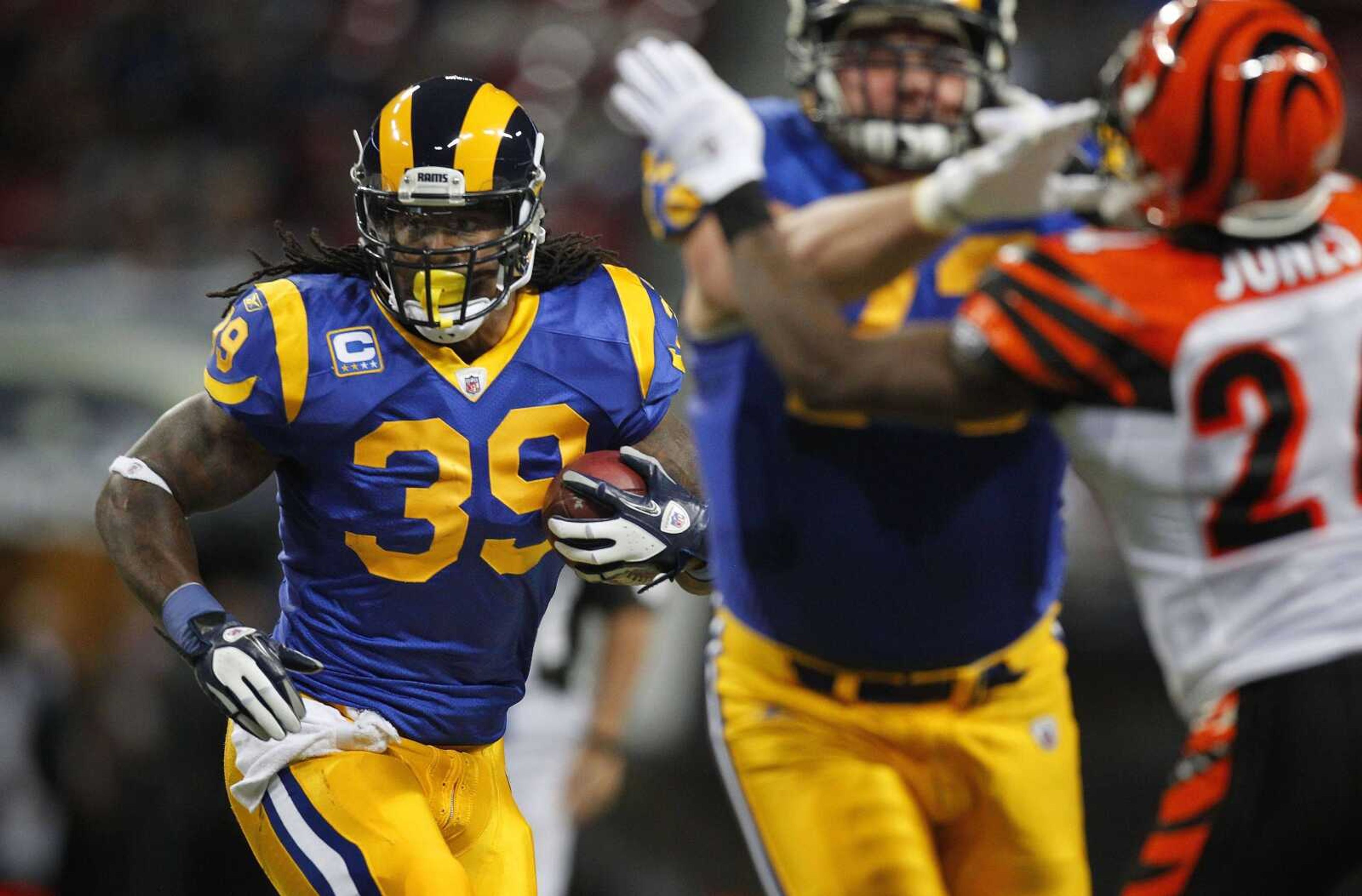 St. Louis Rams running back Steven Jackson (39) runs with the ball against the Cincinnati Bengals' defense during the first quarter of an NFL football game on Sunday, Dec. 18, 2011, in St. Louis. (AP Photo/Jeff Roberson)