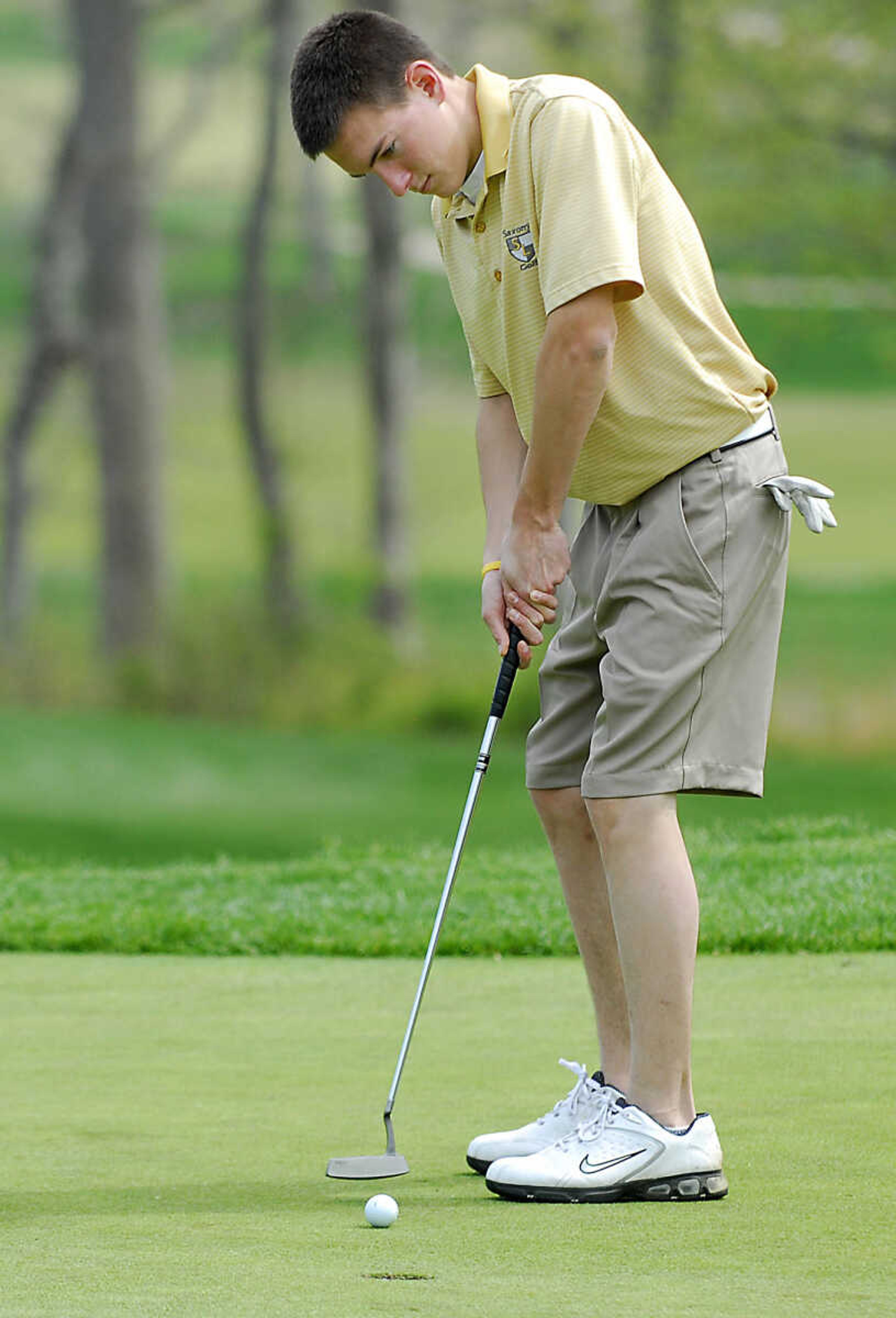 KIT DOYLE ~ kdoyle@semissourian.com
Saxony's Nick Murphy sinks a putt on the 12th green Thursday, April 16, 2009, during the Saxony Lutheran Invitational at Dalhousie Golf Club in Cape Girardeau.