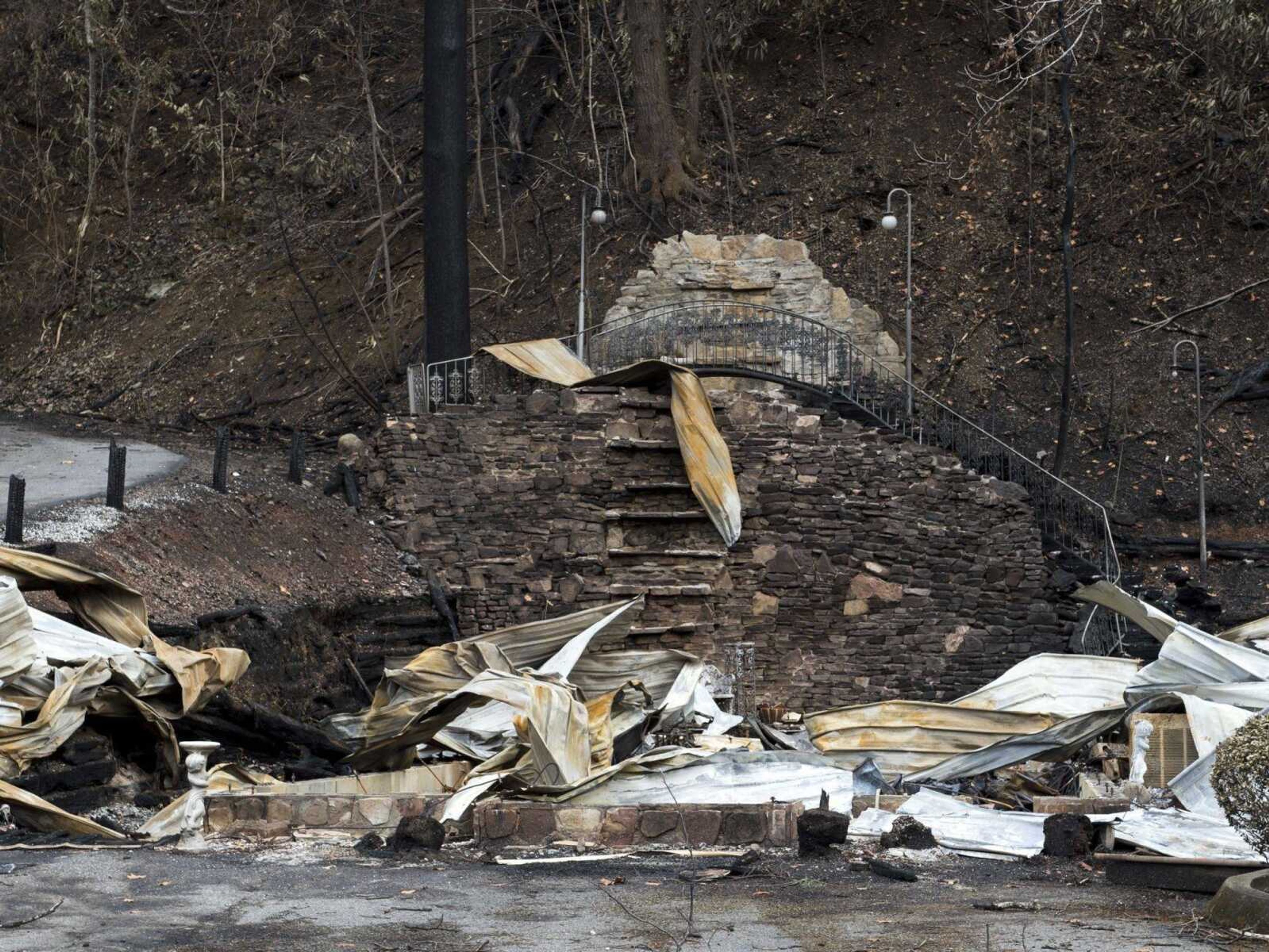 The remains of Cupid's Chapel of Love in Gatlinburg, Tennessee, are shown. Amid deadly wildfires in the Great Smoky Mountains, the city nicknamed "the wedding capital of the South" lost one of its most recognizable places to get hitched.