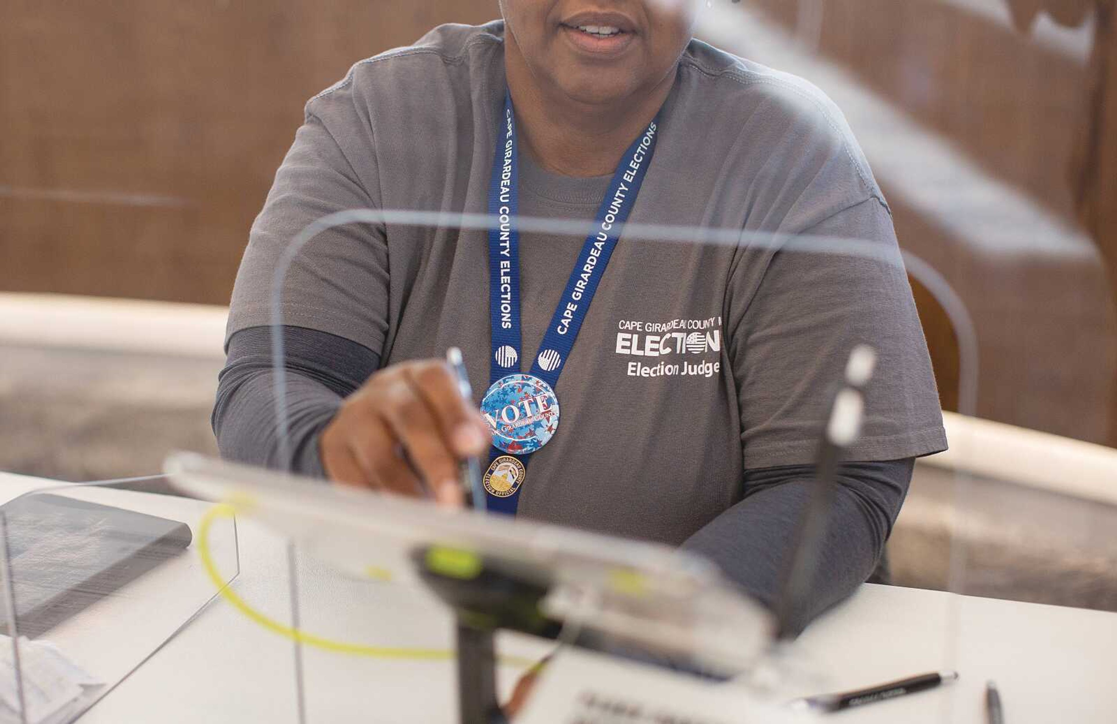 Election judge Tonia Lane reviews the check-in system as she awaits voters at precinct 2A in the Cape Girardeau City Hall on Tuesday, Feb. 8, 2022. Photo by Aaron Eisenhauer