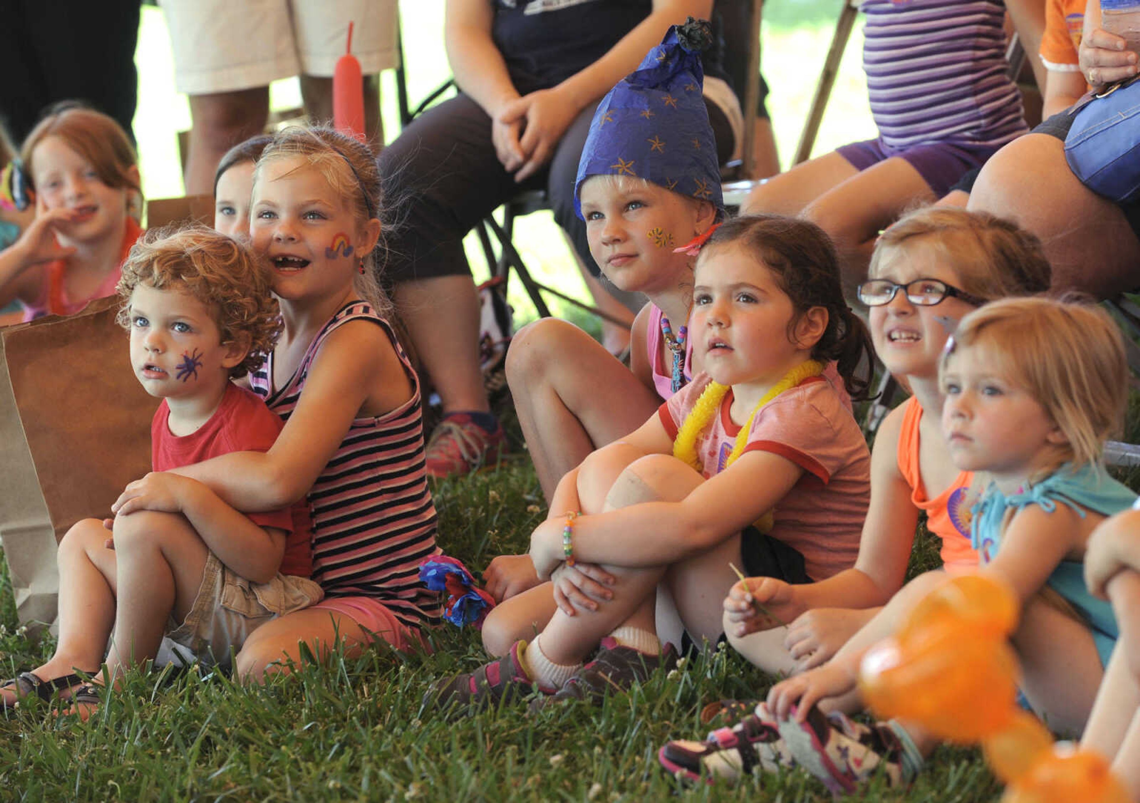 Children watch the magic show by Rob Huff Saturday, June 21, 2014 at the River Campus Summer Arts Festival in Cape Girardeau