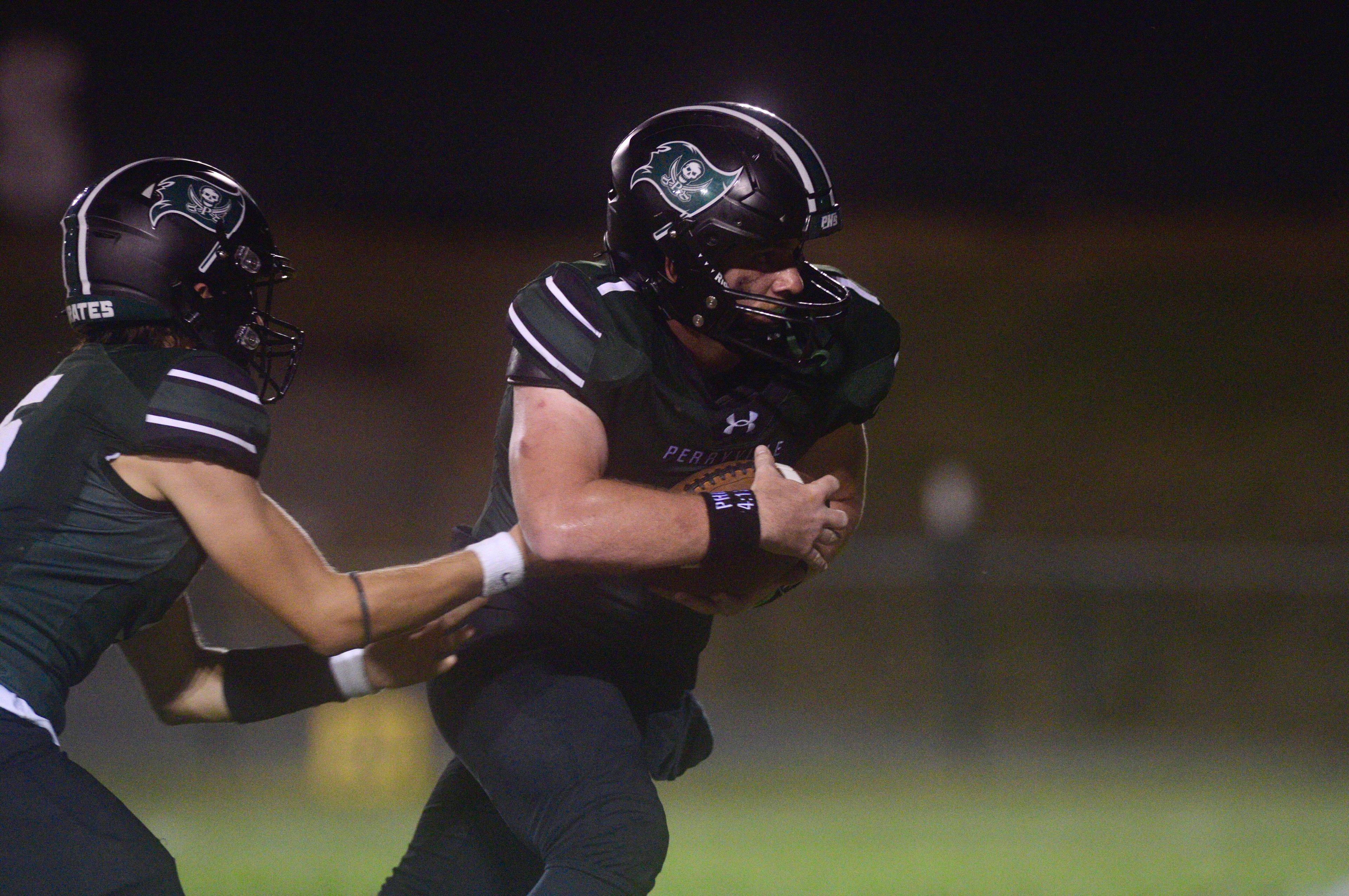 Perryville running back Barrett Wheeler takes an handoff during a game against Fredericktown on Thursday, Aug. 29, in Perryville, Mo. 