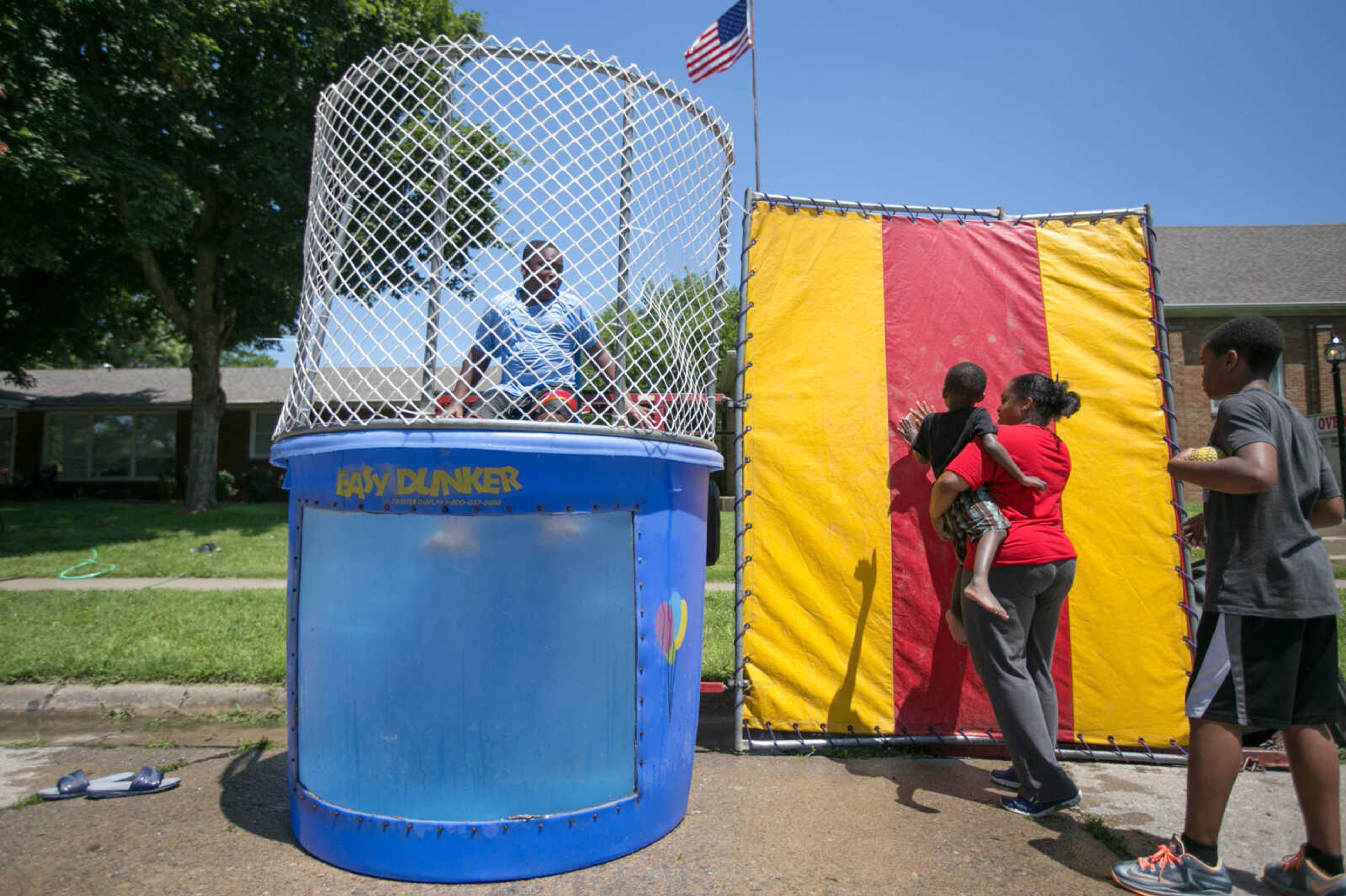 GLENN LANDBERG ~ glandberg@semissourian.com


Daniel Bird Jr. gets dunked by patrons during a block party in Cape Girardeau's ward 2 area, Saturday, June 20, 2015.