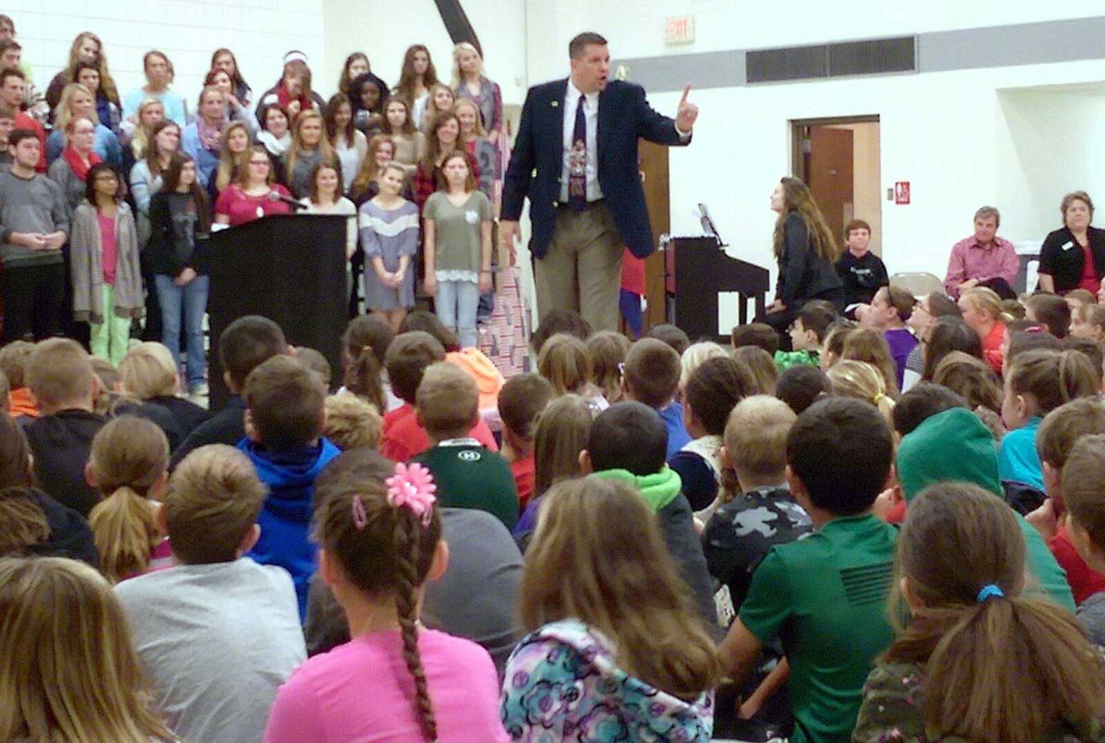 Jackson school superintendent John Link talks to students Monday during a flag-raising ceremony at West Lane Elementary, where students and staff celebrated the start of American Education Week. (Katie Lamb)