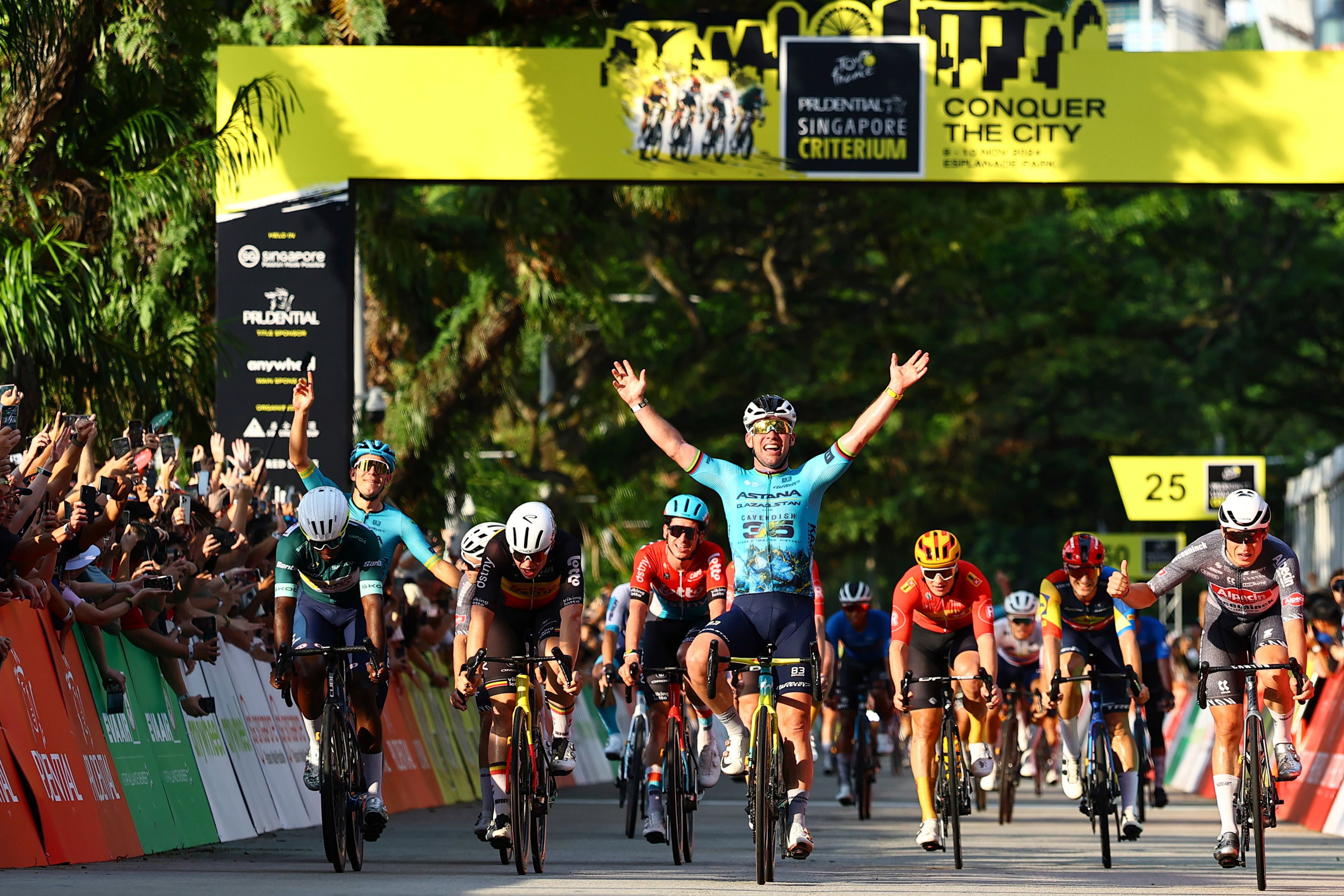 Britain's Mark Cavendish of Astana Qazaqstan, centre, sprints to win the Prudential Singapore Tour De France Criterium, Sunday, November 10th, 2024. (AP Photo/Danial Hakim)