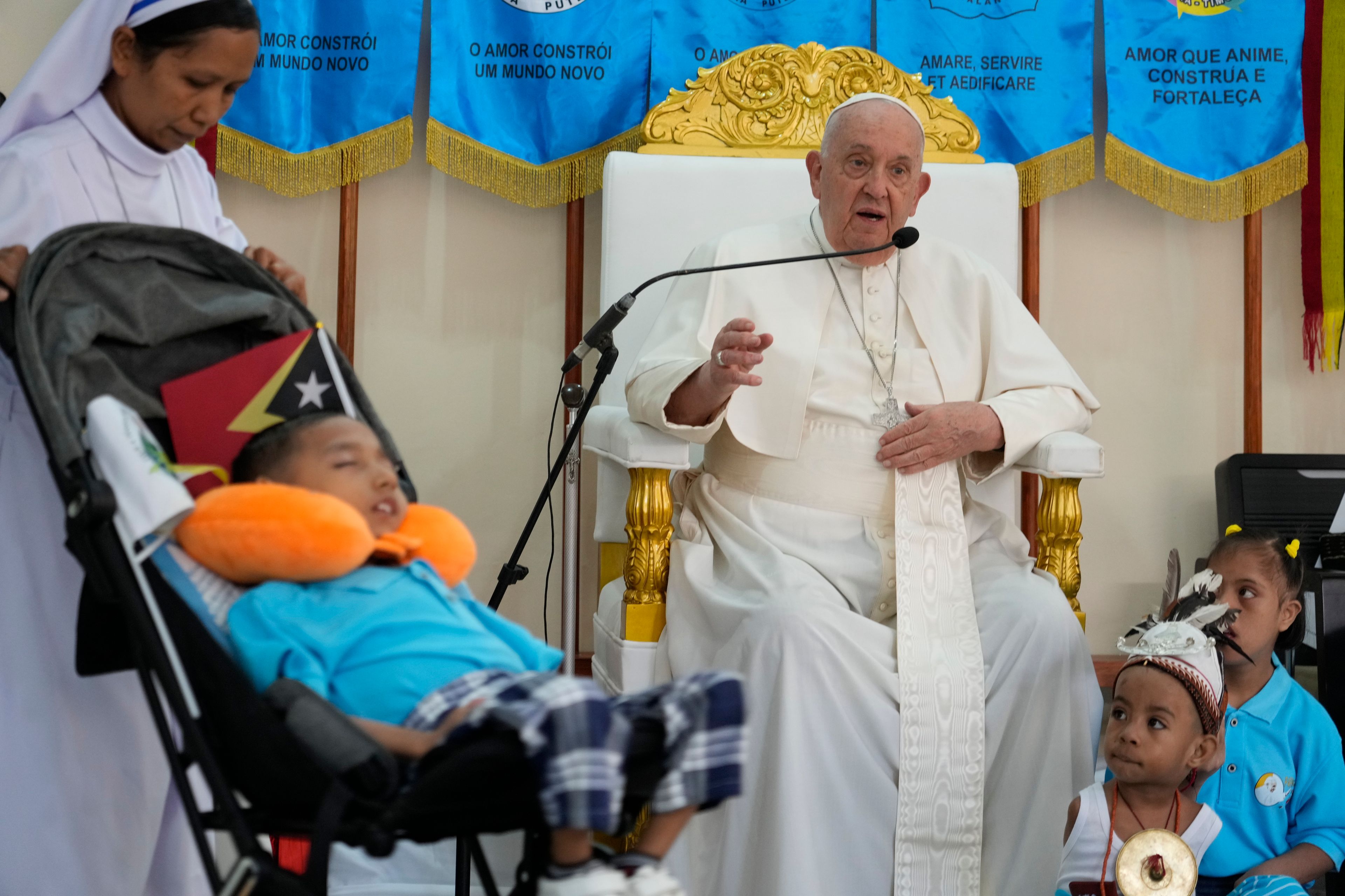 Pope Francis speaks during a visit at the 'Irmas ALMA' (Sisters of the Association of Lay Missionaries) School for Children with Disabilities in Dili, East Timor, Tuesday, Sept. 10, 2024. Pope Francis has indirectly acknowledged the abuse scandal in East Timor involving its Nobel Peace Prize-winning independence hero Bishop Carlos Filipe Ximenes Belo. (AP Photo/Gregorio Borgia)