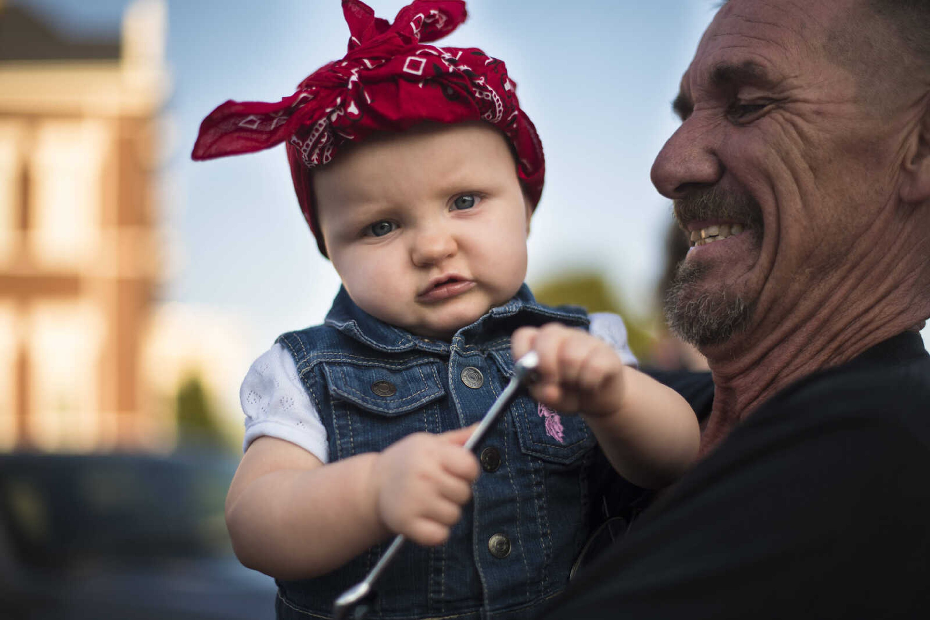 Roy Lewis holds his granddaughter Roselynn Sheppard during the Perryville Pinup contest Saturday, Sept. 2, 2017 in downtown Perryville.